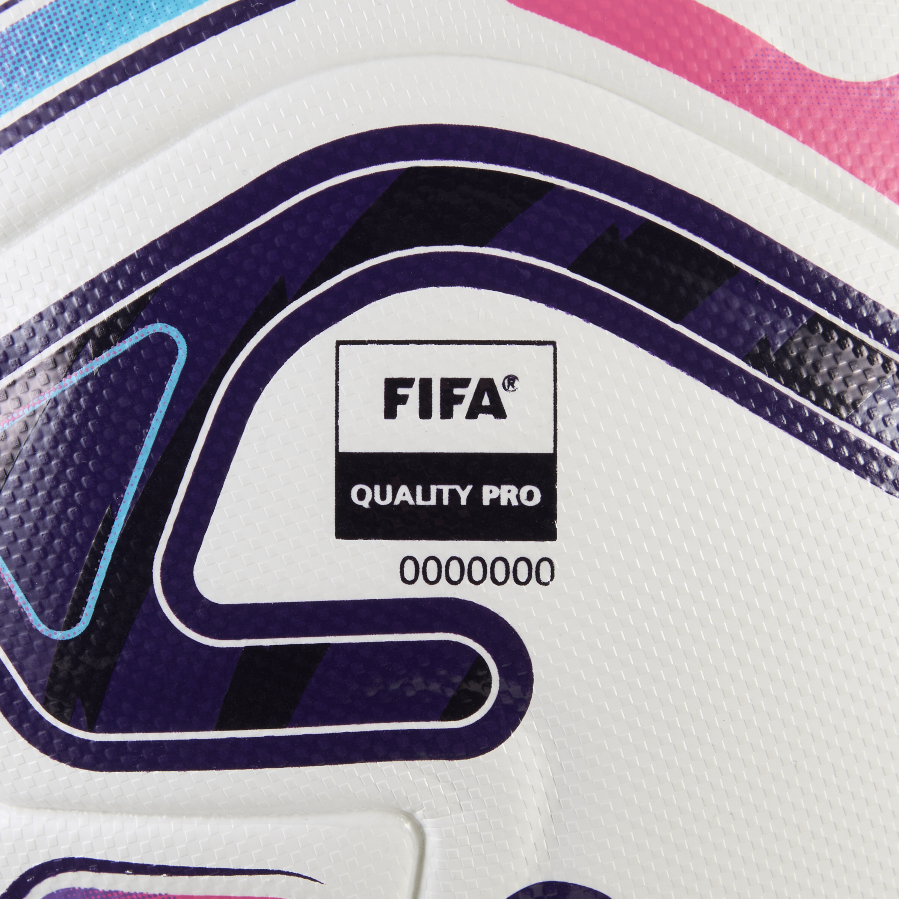 Close-up of a white soccer ball with purple and pink accents, featuring the FIFA Quality Pro logo and the serial number 0000000.