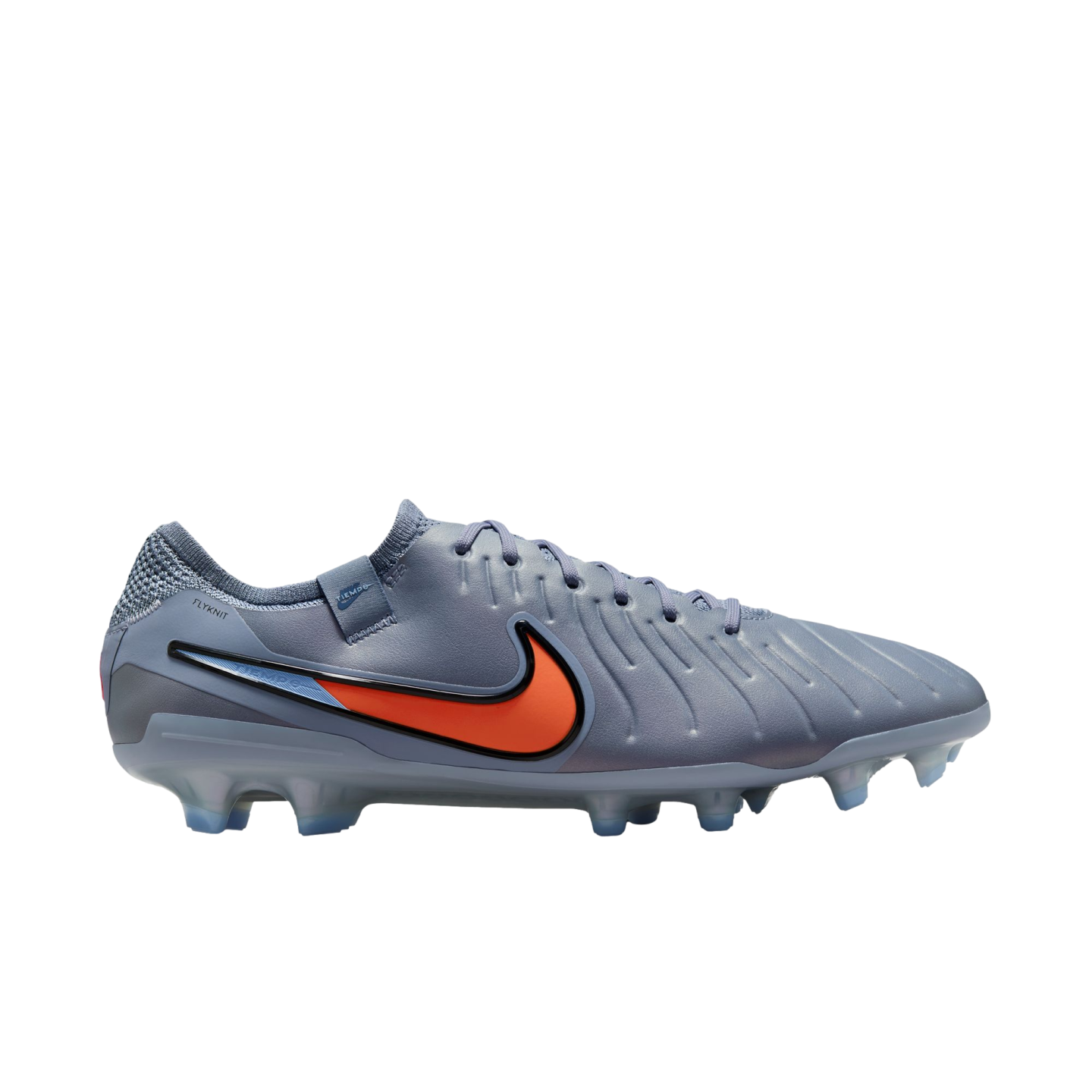 A slate grey Nike Tiempo soccer cleat with an orange and black swoosh and translucent studs, shown in profile against a black background.