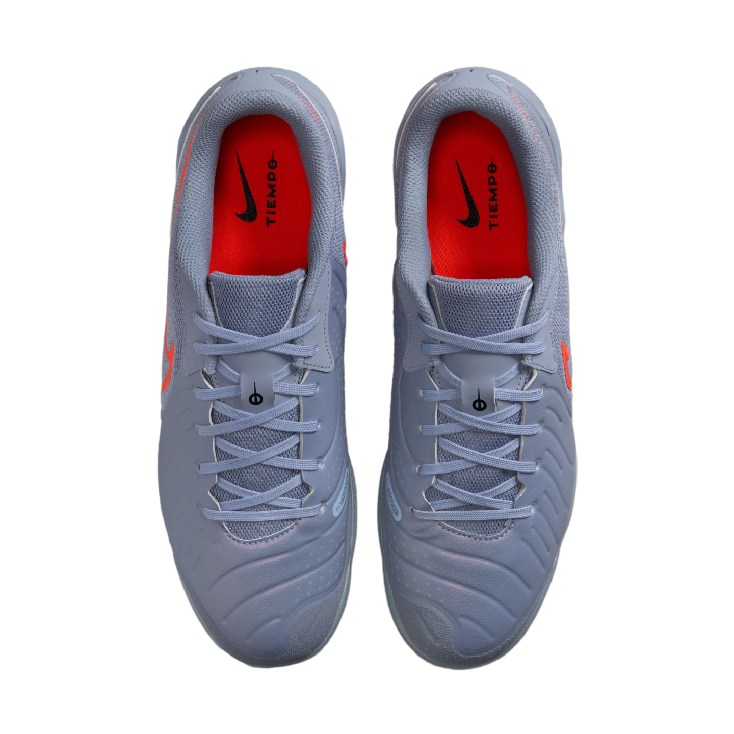 Top-down view of light blue Nike Tiempo soccer cleats with red insoles and orange swoosh logos.