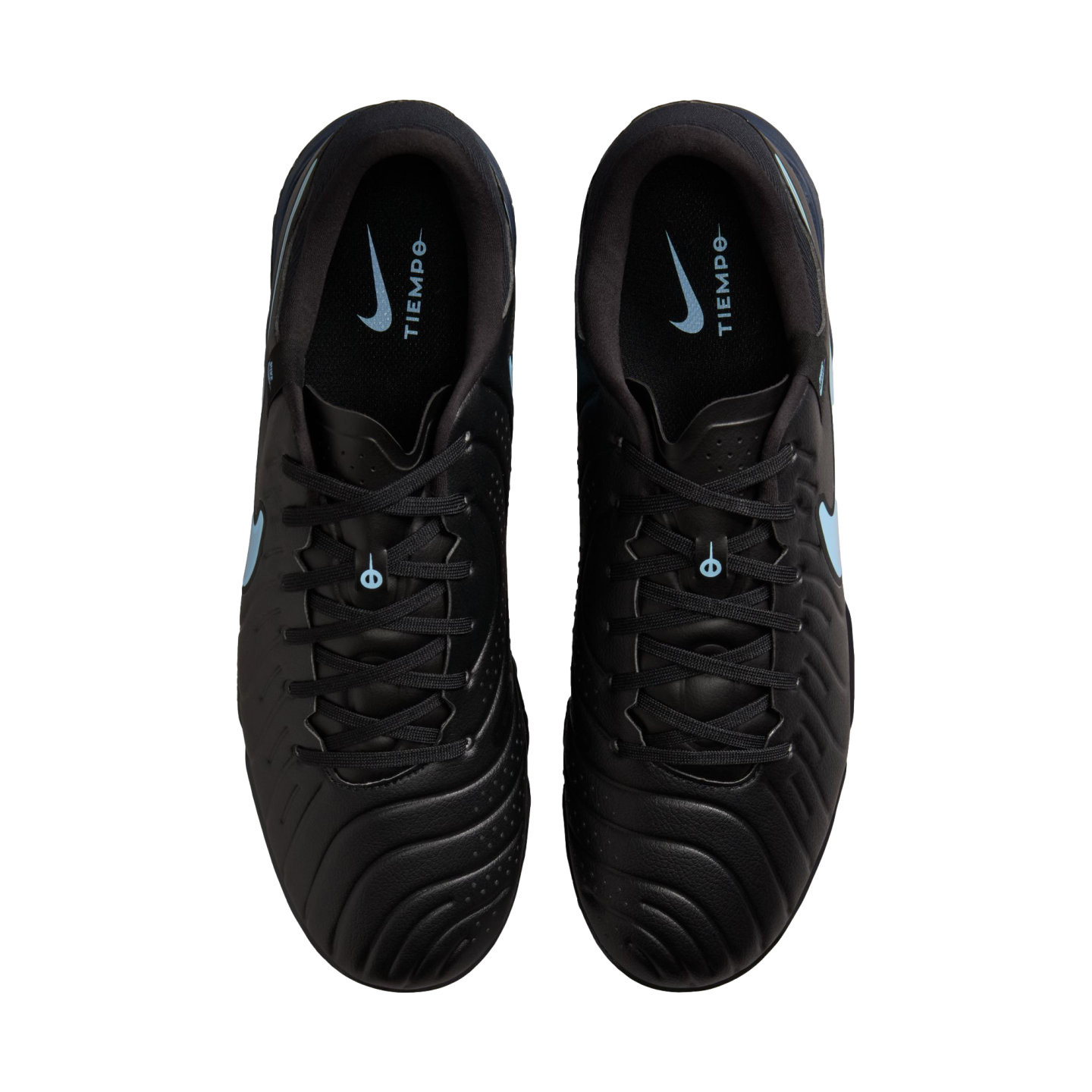 Top-down view of black Nike Tiempo soccer cleats with light blue accents on a black background.