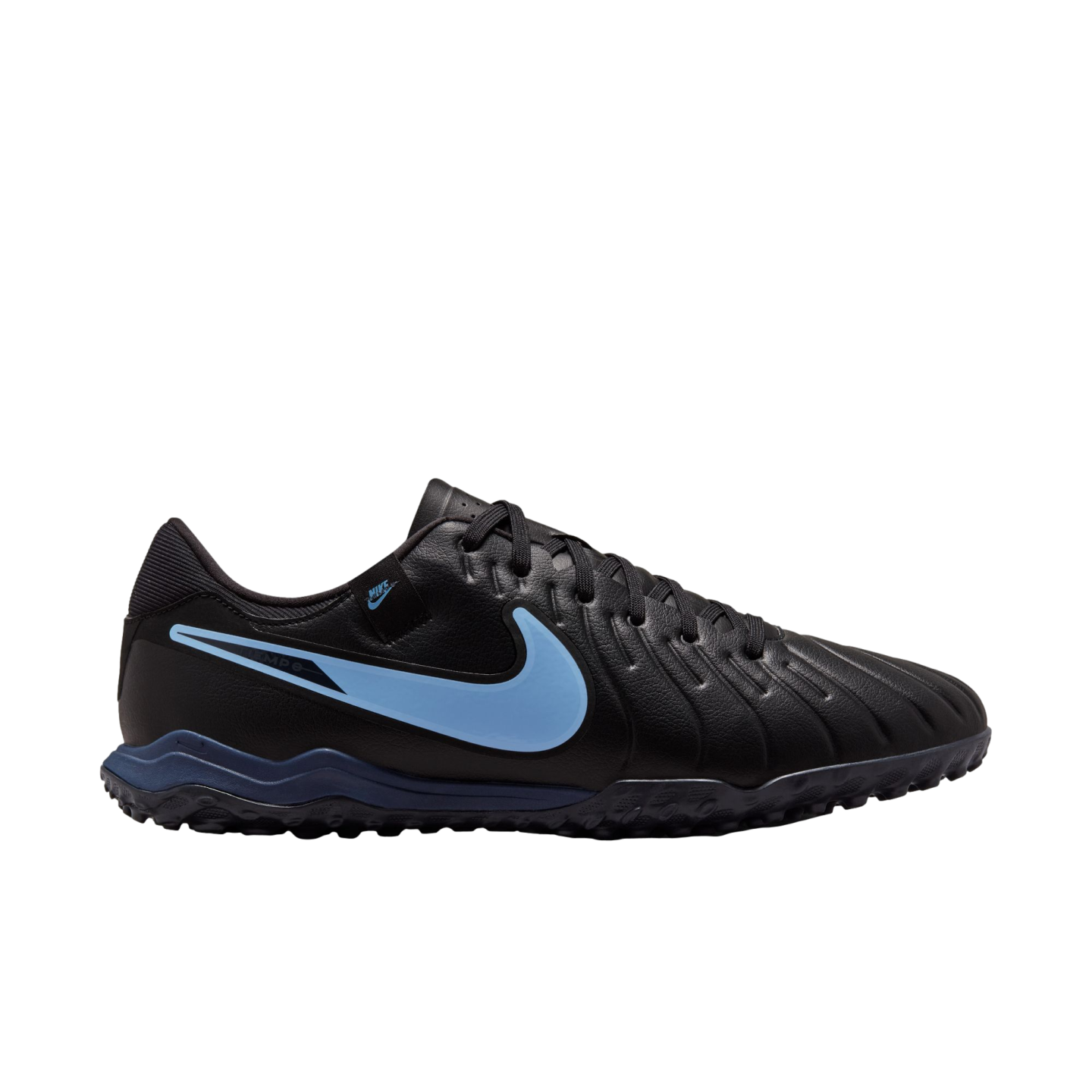 A black Nike Tiempo turf soccer shoe with a light blue swoosh and dark blue sole accents, shown from the side against a black background.
