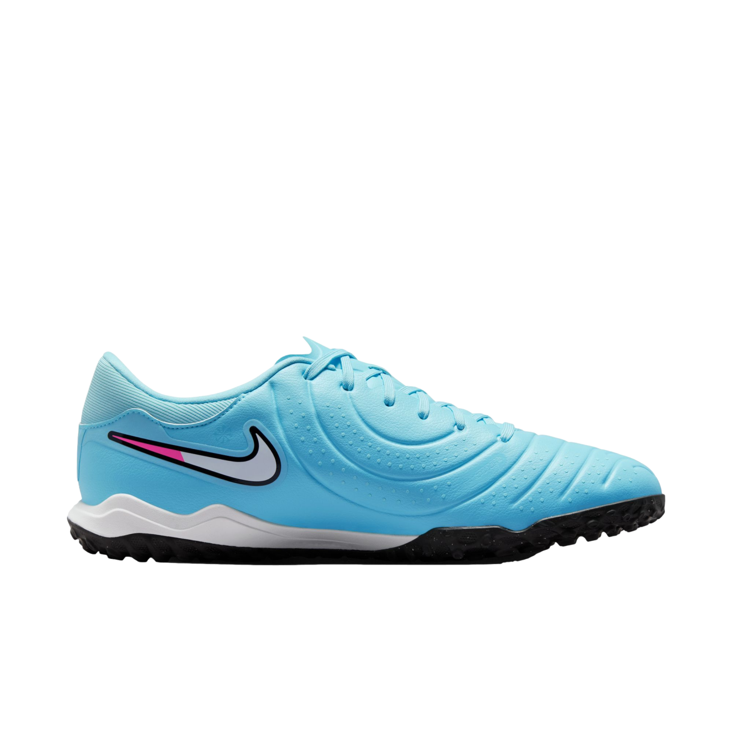 Side profile of a light blue Nike turf soccer shoe with a textured, wavy upper, a white swoosh with pink accents, and a black rubber outsole.