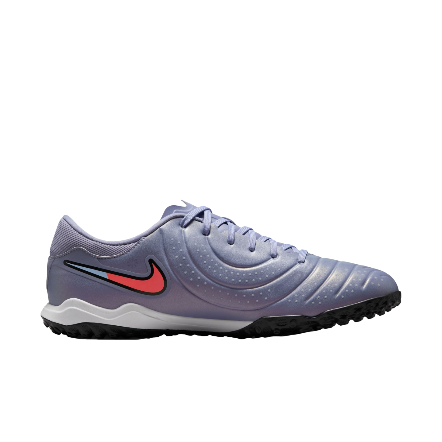 Side profile of a lavender Nike soccer shoe with a pink and blue swoosh, white midsole, and black nubbed outsole, set against a black background.