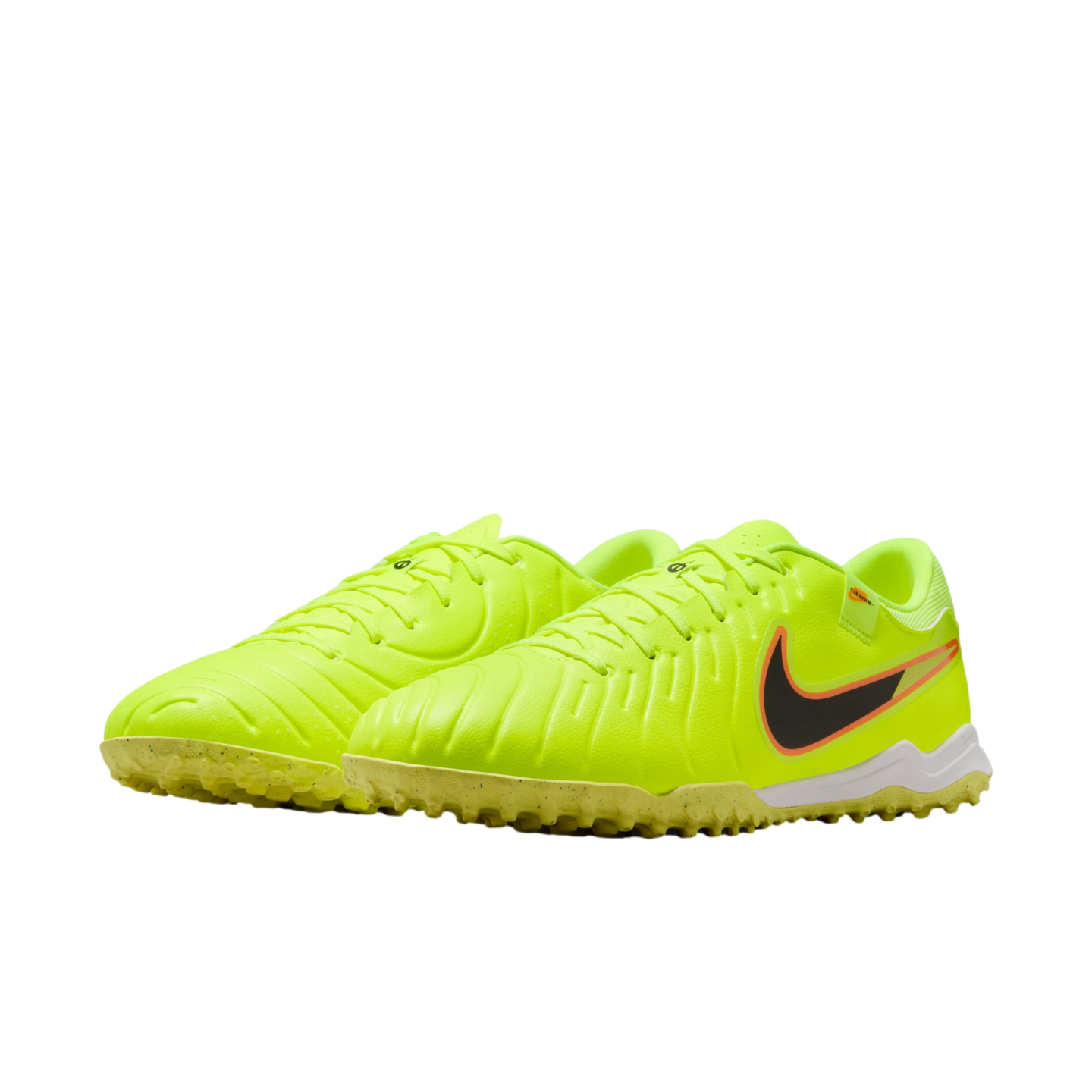 A pair of neon yellow Nike turf soccer shoes with a black and orange swoosh logo, displayed against a plain black background.