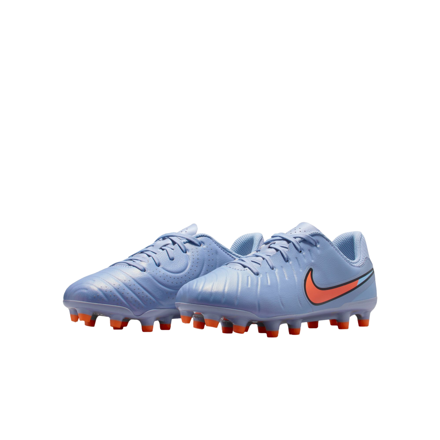 Light blue Nike soccer cleats for kids featuring orange studs and an orange swoosh logo, shown against a black background.