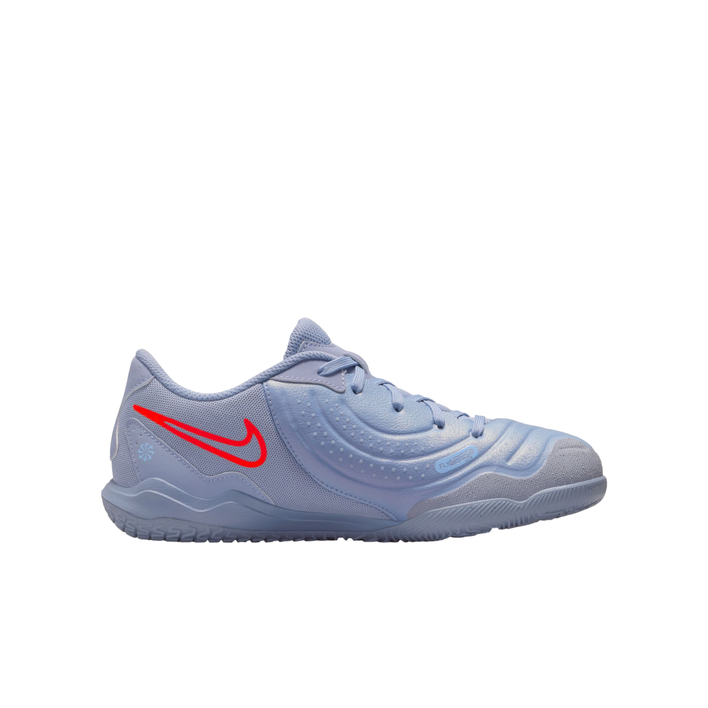 A light blue Nike indoor soccer shoe with a bright red swoosh and a textured upper, designed for court play with a flat rubber outsole.