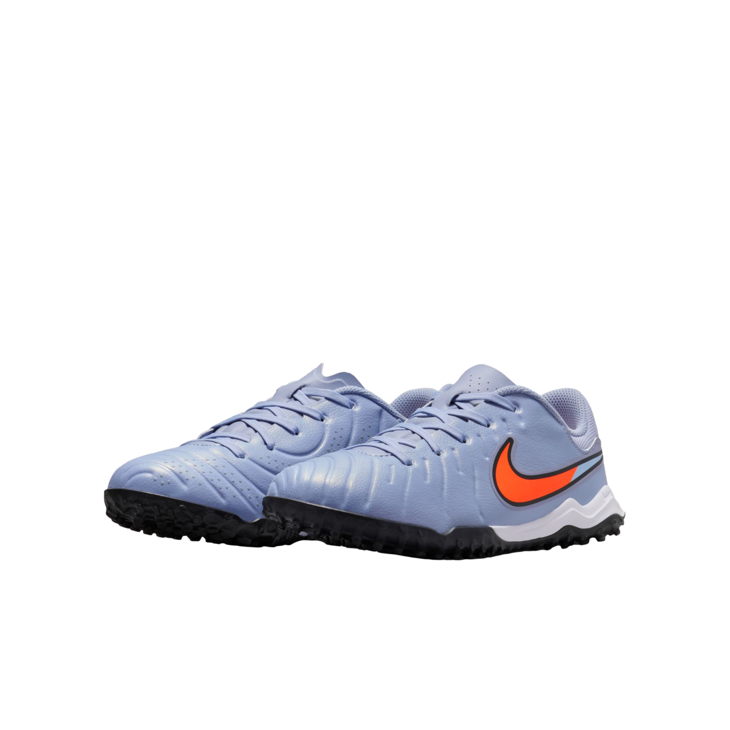 A pair of light blue Nike turf soccer shoes featuring a bright orange swoosh and black rubber soles, set against a black background.