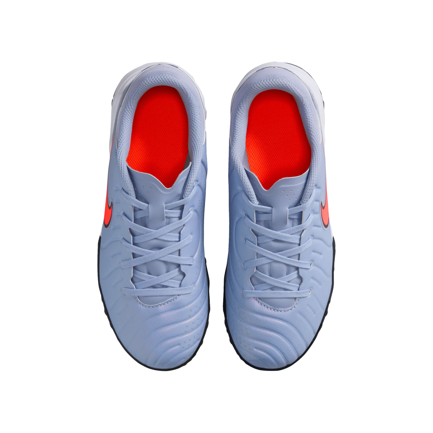 Top-down view of a pair of light blue Nike athletic shoes with bright orange interiors and orange Nike swooshes, set against a solid black background.
