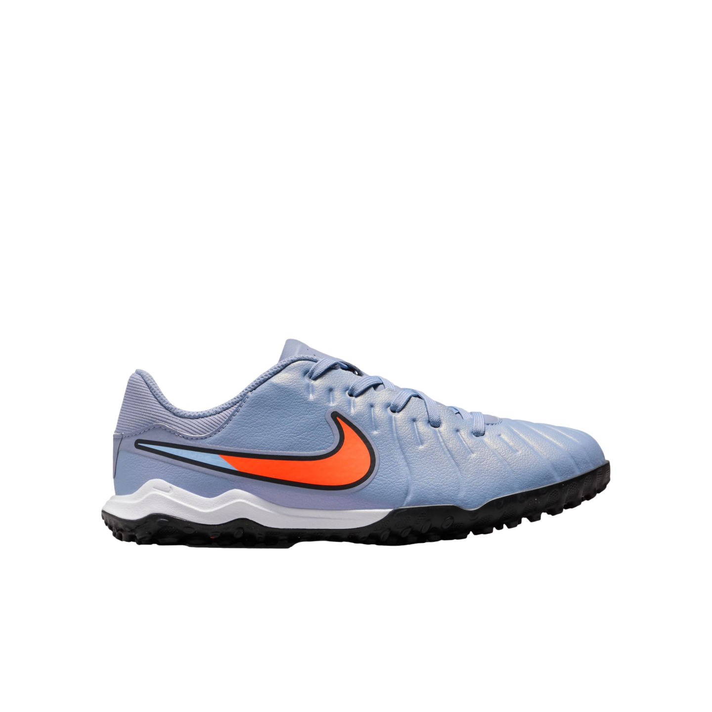 A light blue Nike soccer turf shoe with a large orange swoosh, white midsole, and black knobby outsole, set against a plain black background.