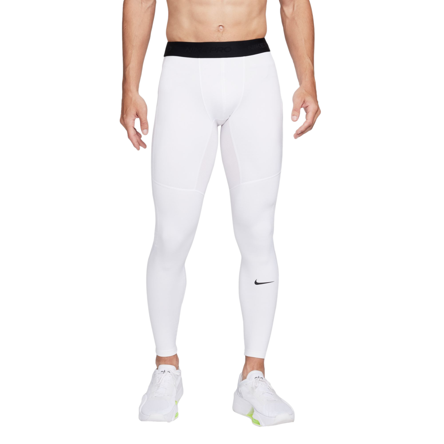 A man from the waist down wearing white Nike Pro compression leggings and white sneakers against a white background.