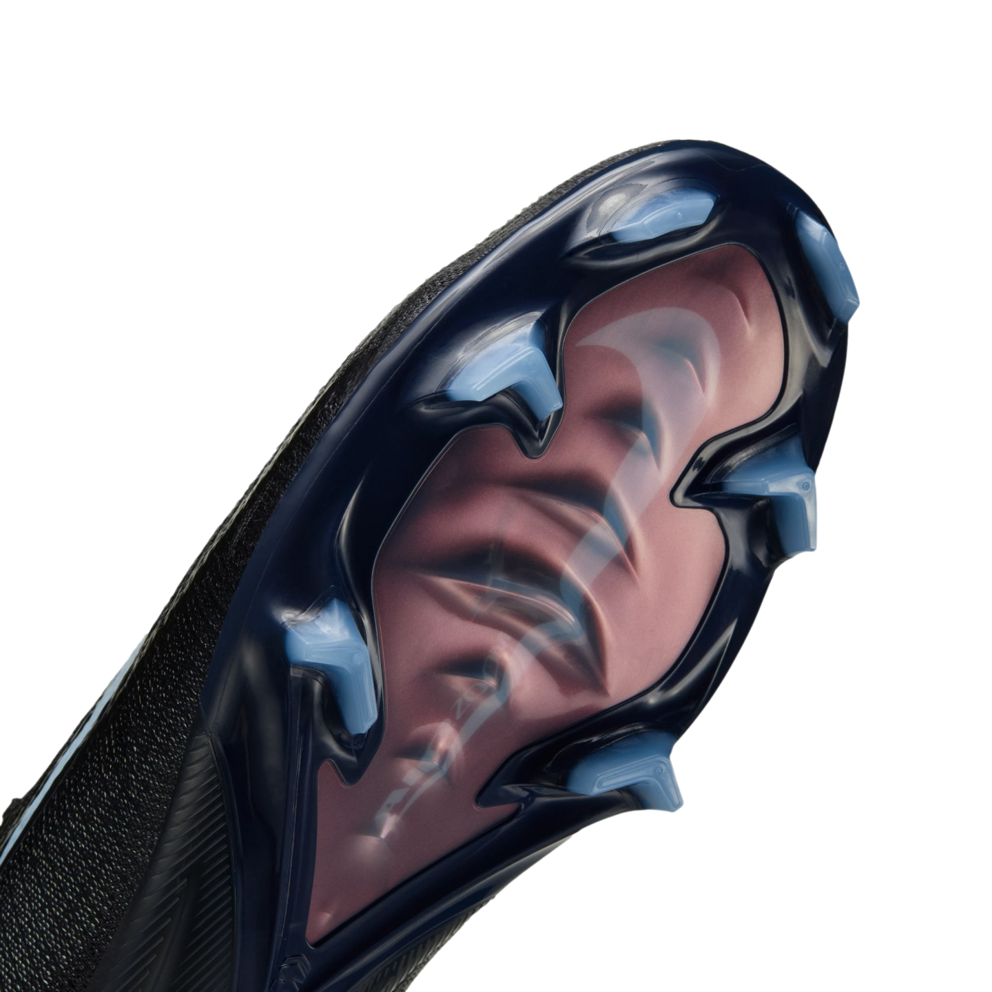 Close-up of a Nike soccer shoe sole with a translucent dark blue plate, light blue studs, and a large pink swoosh visible underneath.