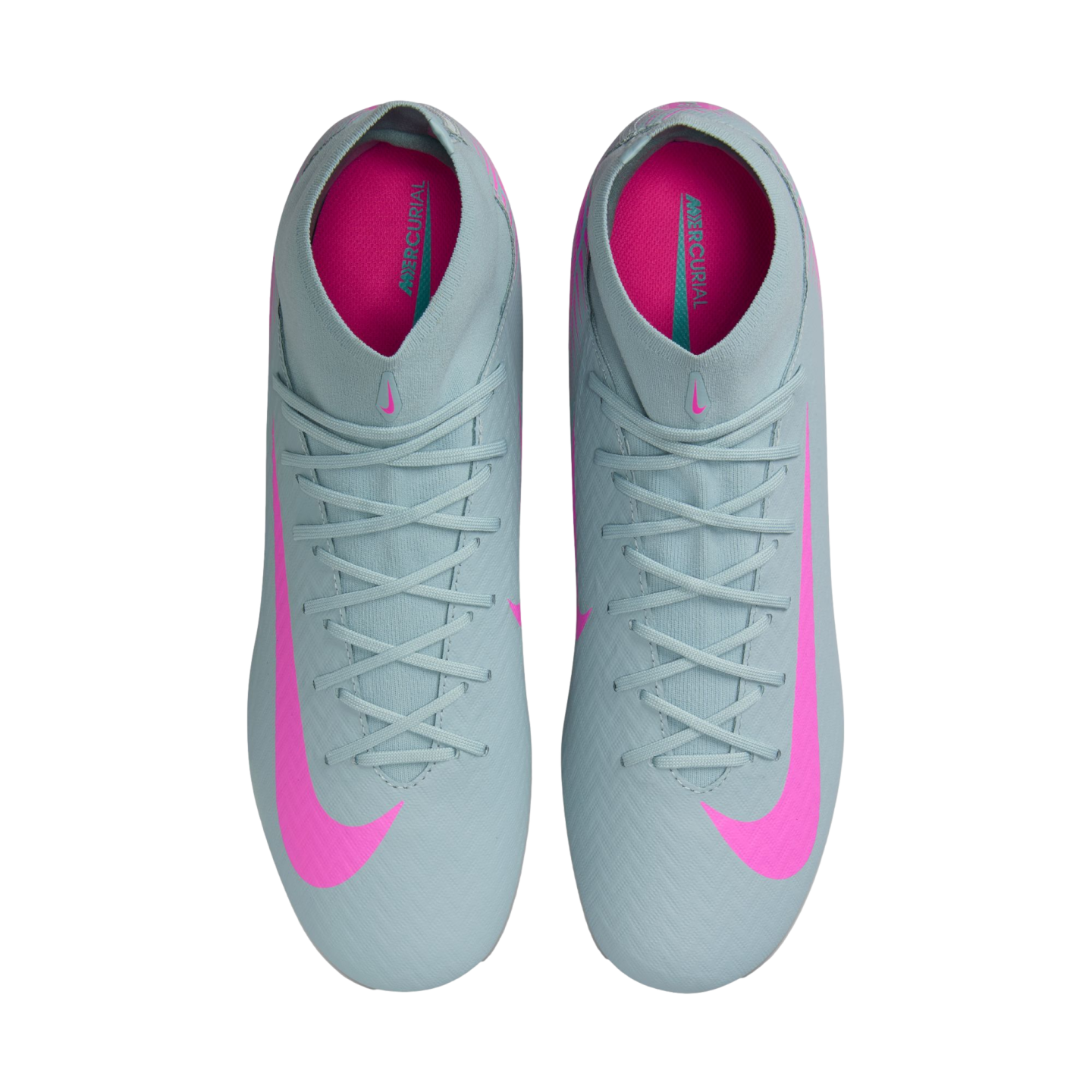 A top-down view of light grey Nike Mercurial soccer cleats featuring large bright pink Swooshes and neon pink insoles.