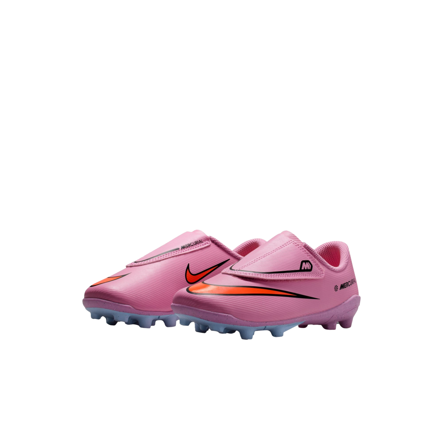 A pair of pink Nike Mercurial kids' soccer cleats with orange swooshes and velcro straps, displayed against a black background.