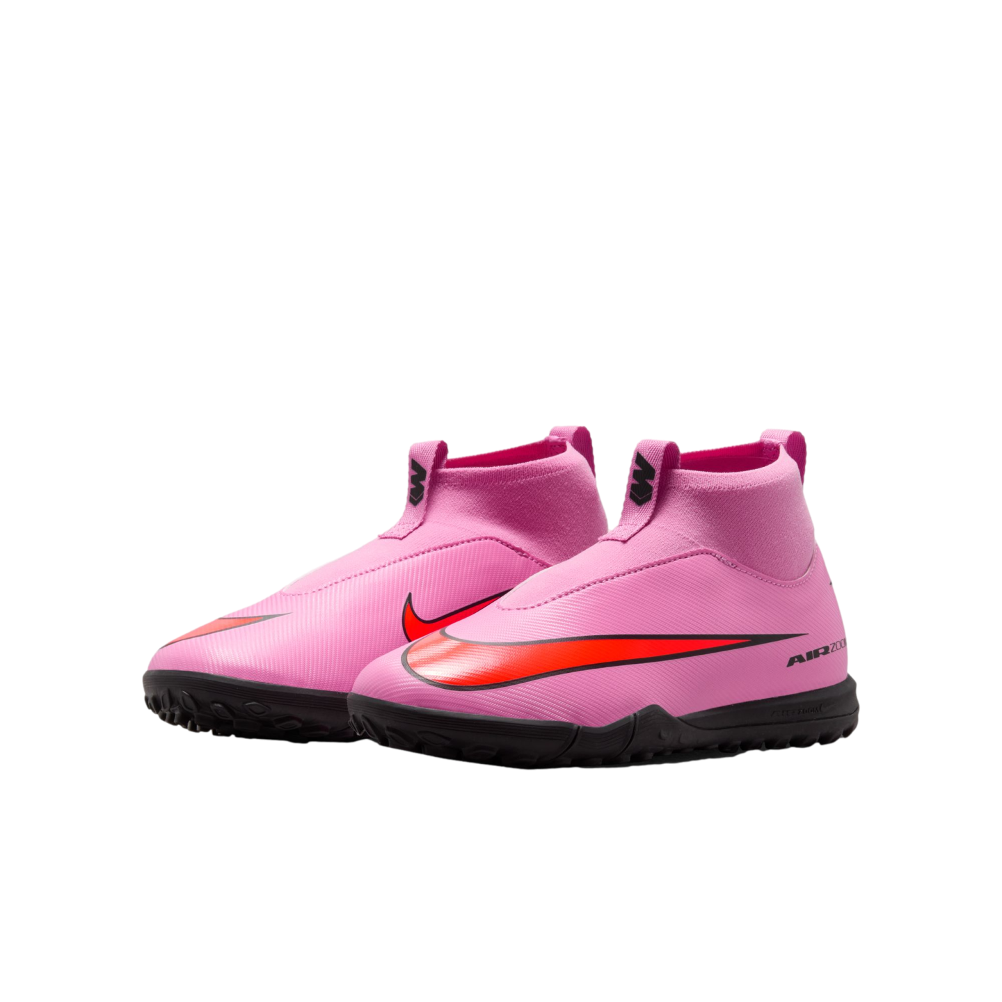 A pair of pink laceless Nike Air Zoom soccer shoes with a red swoosh and black turf soles, set against a black background.