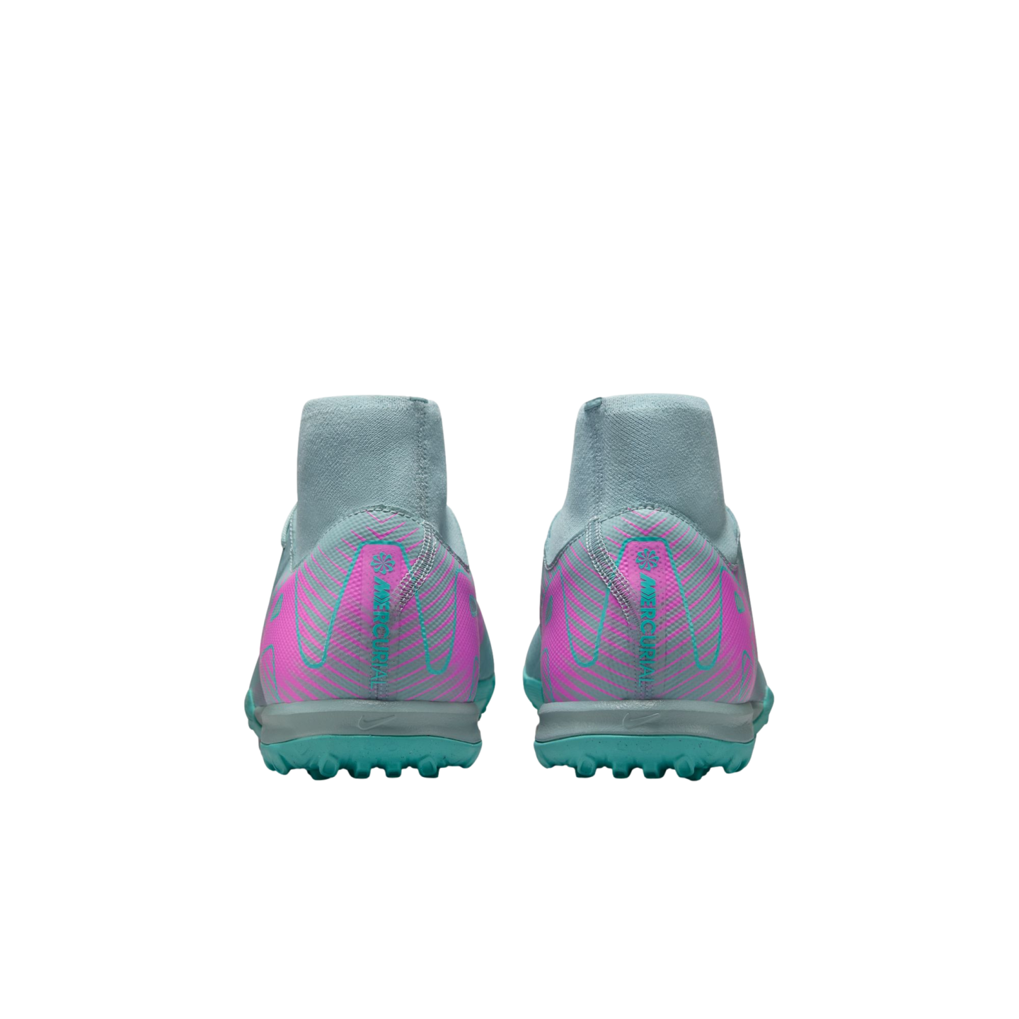 Back view of grey Nike Mercurial soccer cleats featuring pink and teal patterns on the heel and a teal studded turf outsole.