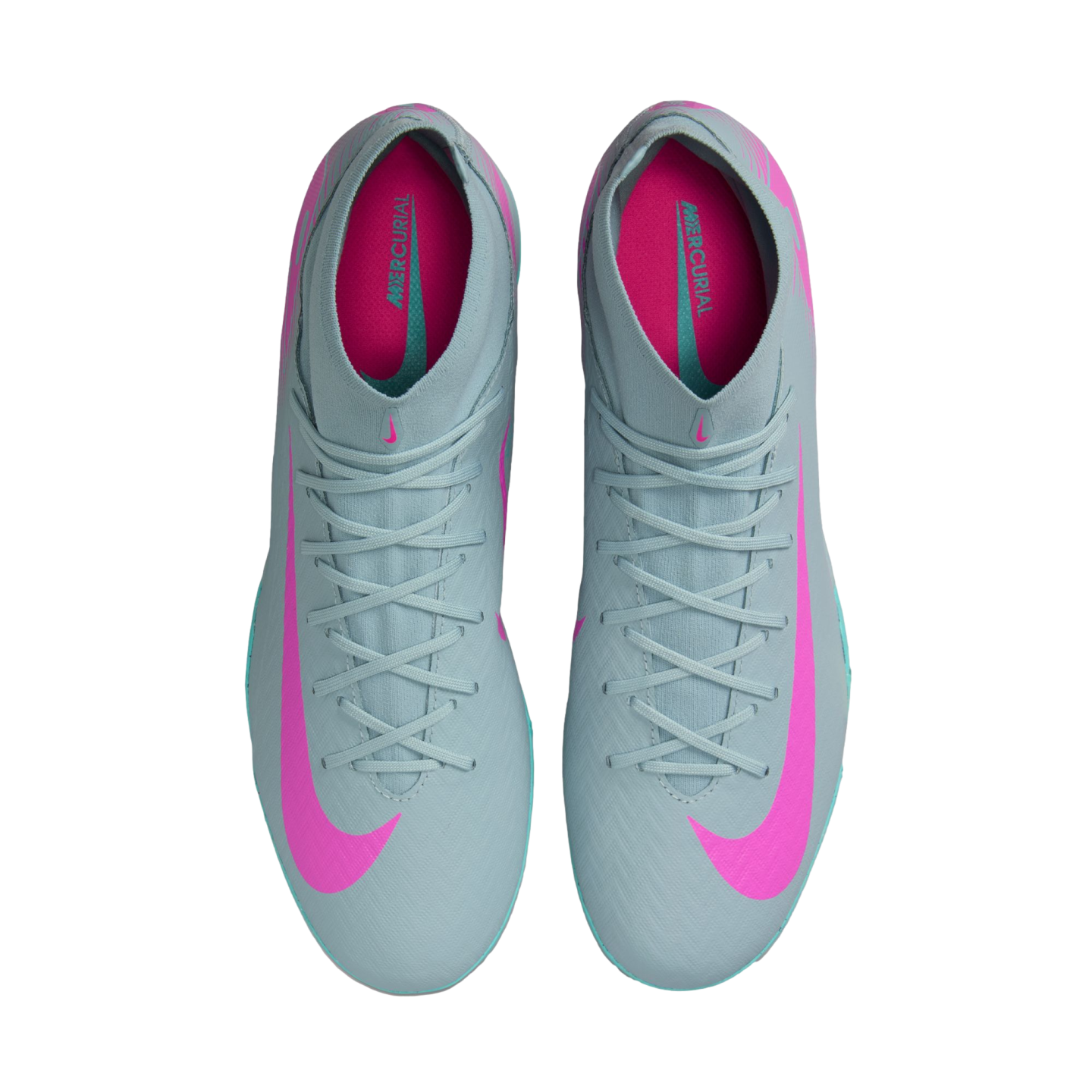 Top-down view of light grey Nike Mercurial soccer cleats featuring vibrant pink swooshes and interiors against a white background.