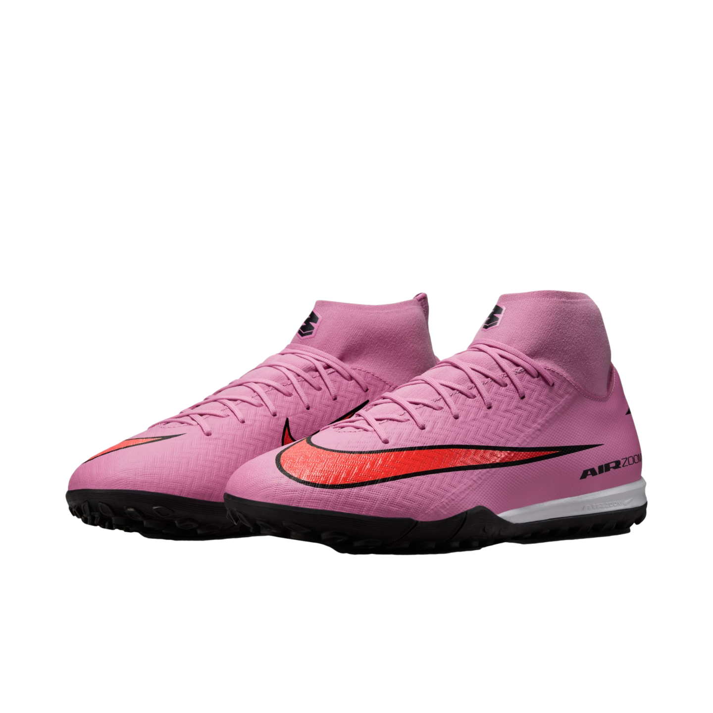 A pair of pink Nike Mercurial Superfly soccer turf shoes with a bold red swoosh, high-top collar, and black outsole on a black background.