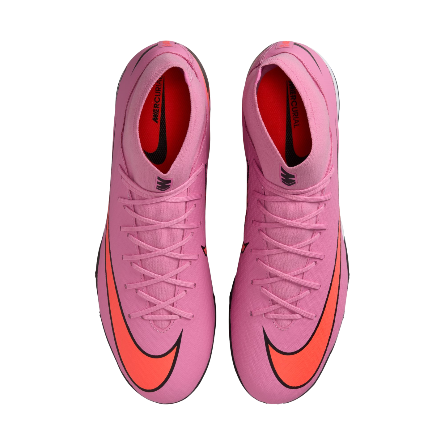 Top-down view of pink Nike Mercurial soccer cleats with bright orange swooshes and matching laces, set against a solid black background.