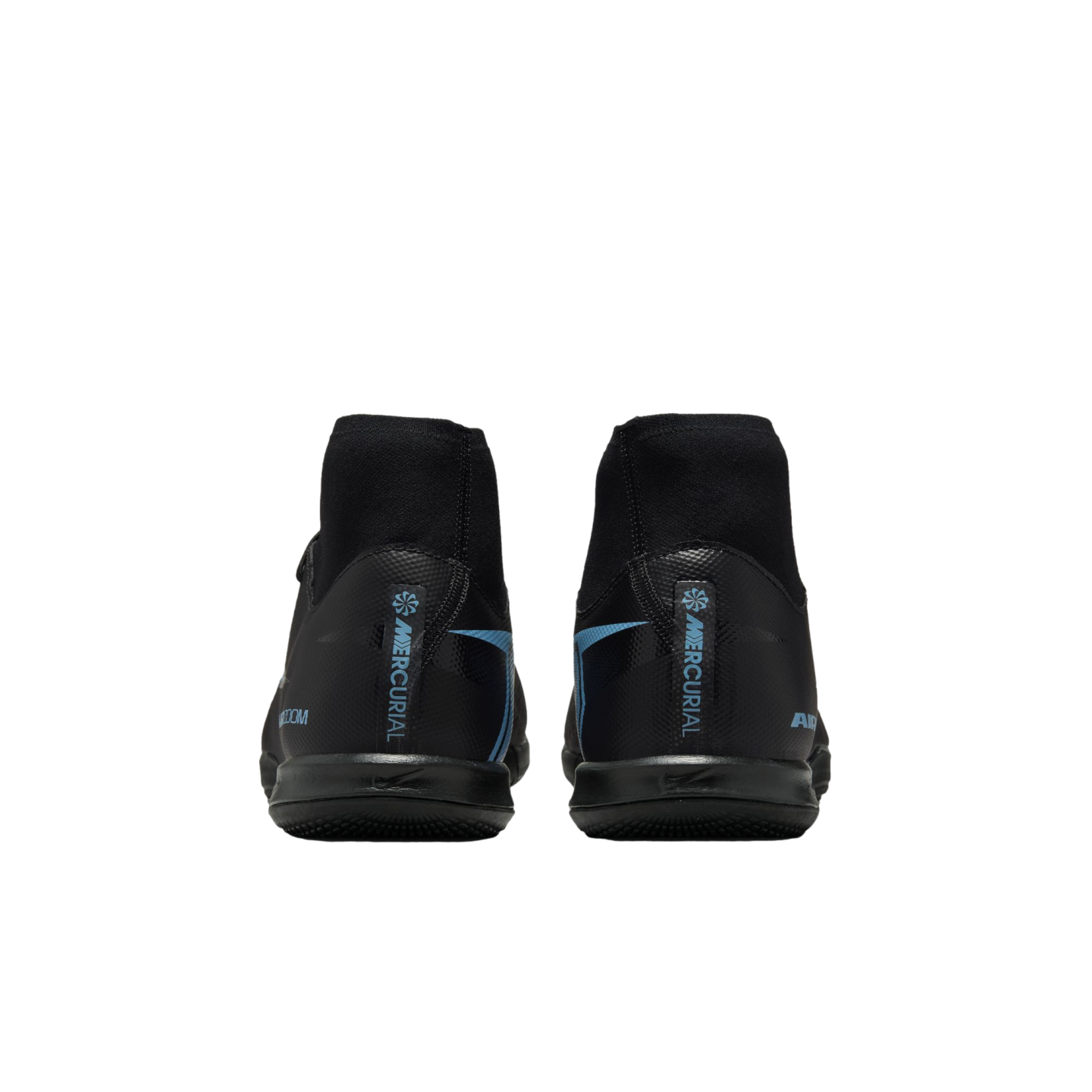 Rear view of black soccer shoes with light blue 'MERCURIAL' branding and high-top sock collars, set against a solid black background.