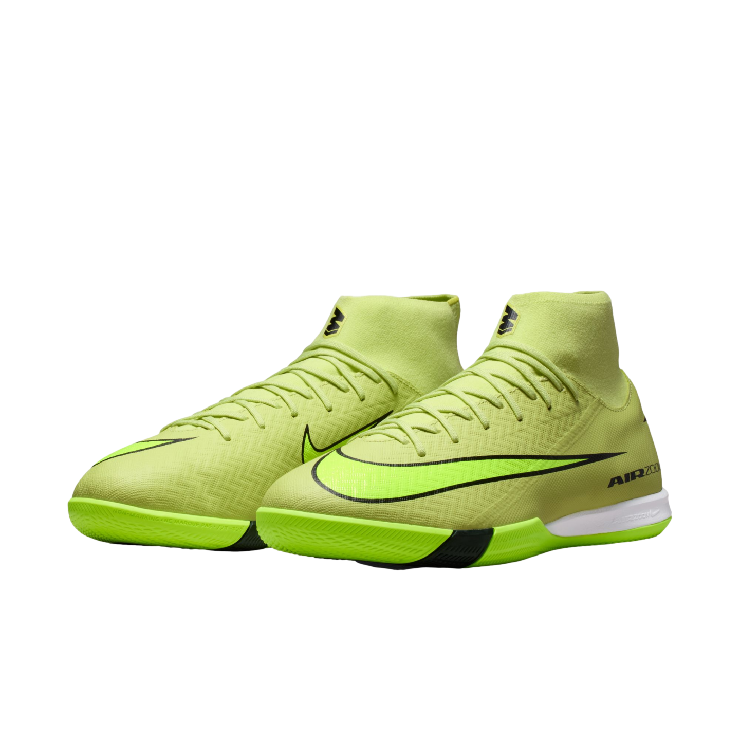 Pair of neon green Nike indoor soccer shoes with a high-top sock-like collar and black swooshes, set against a plain black background.