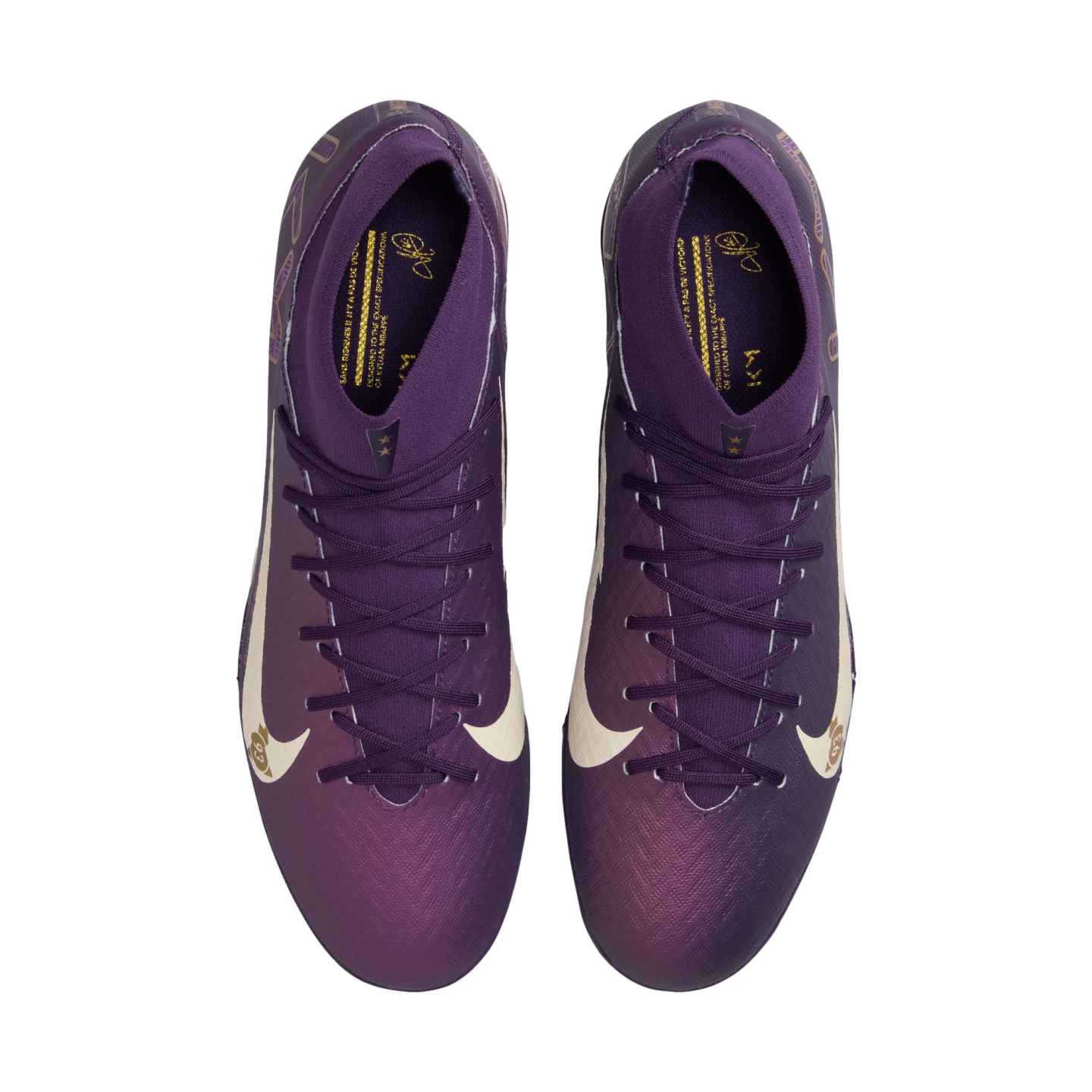 Top-down view of purple Nike Kylian Mbappé soccer cleats with iridescent toes and white swooshes on a white background.