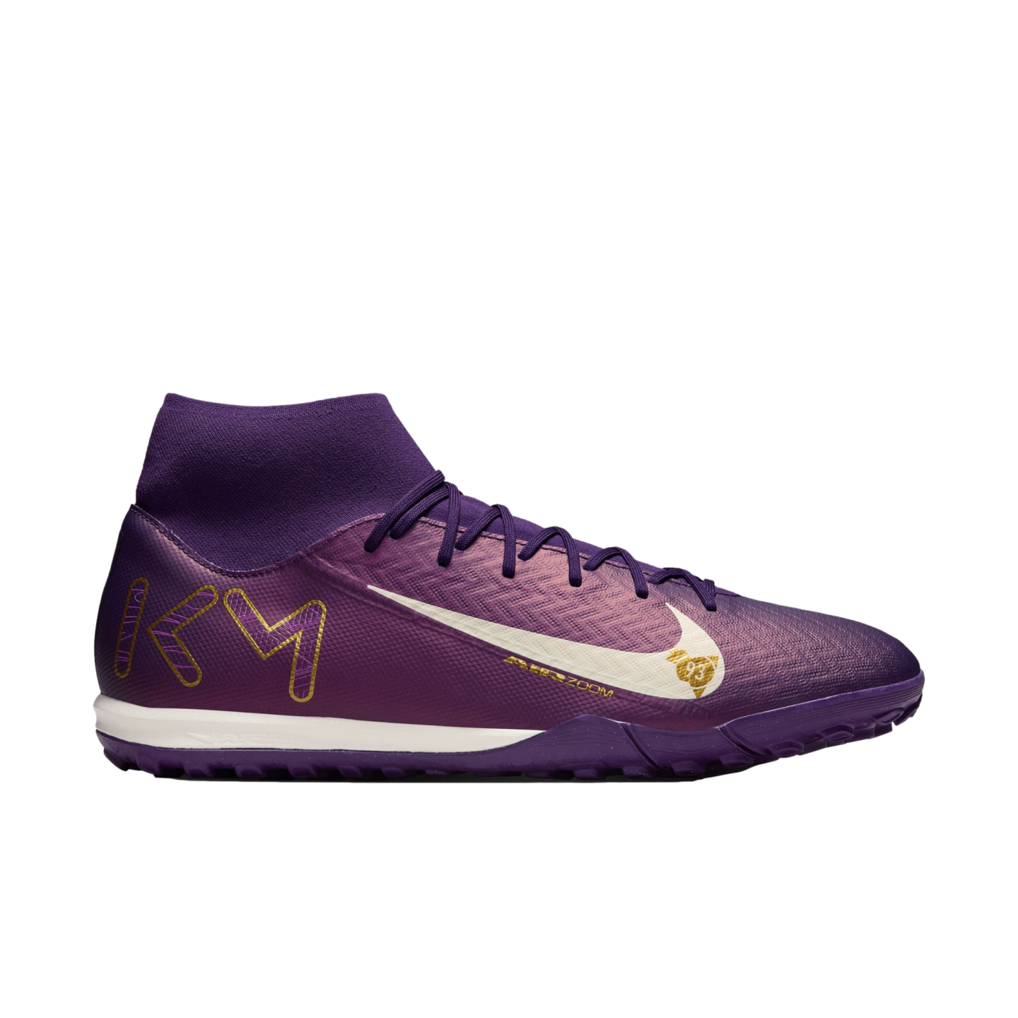 A purple Nike soccer shoe with a white swoosh, gold "KM" logo on the heel, and a high-top sock collar, shown from the side against a white background.