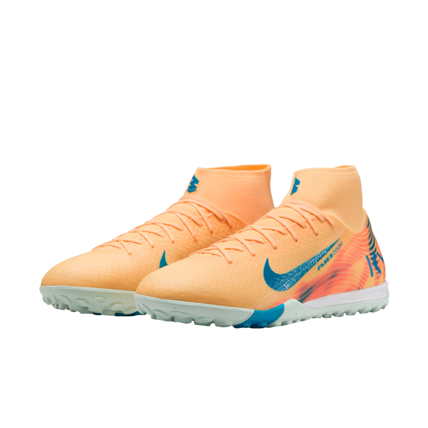 Pair of light orange Nike soccer turf shoes with blue Nike swoosh logos and high-top sock collars.