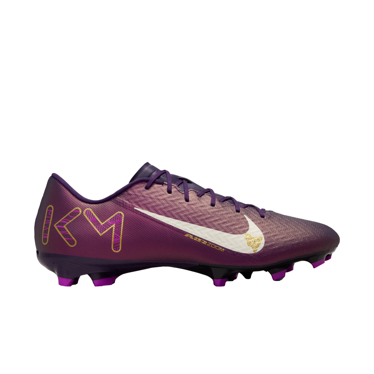 Profile view of a purple Nike soccer cleat featuring a white swoosh logo and gold "KM" initials on the heel, isolated on a white background.