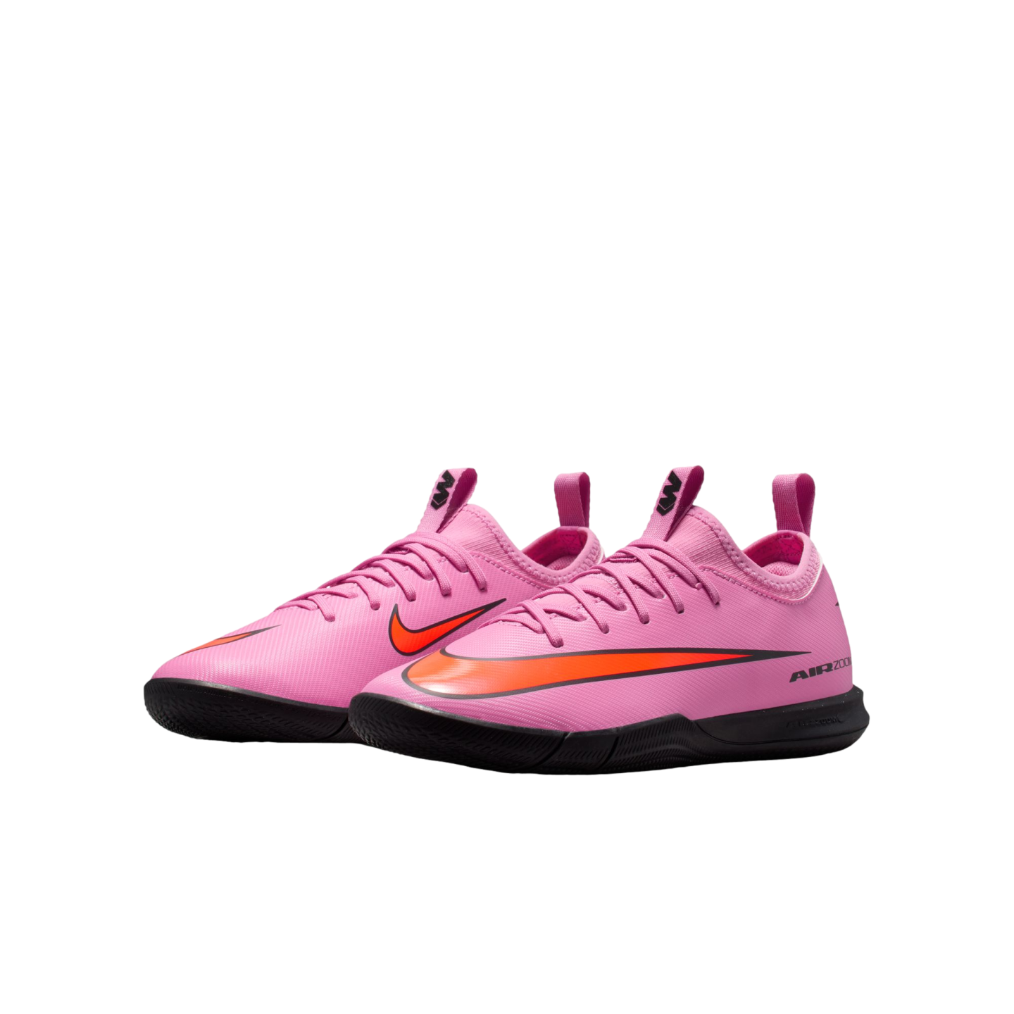 A pair of pink Nike Air Zoom Mercurial indoor soccer shoes with orange accents and black soles, set against a black background.