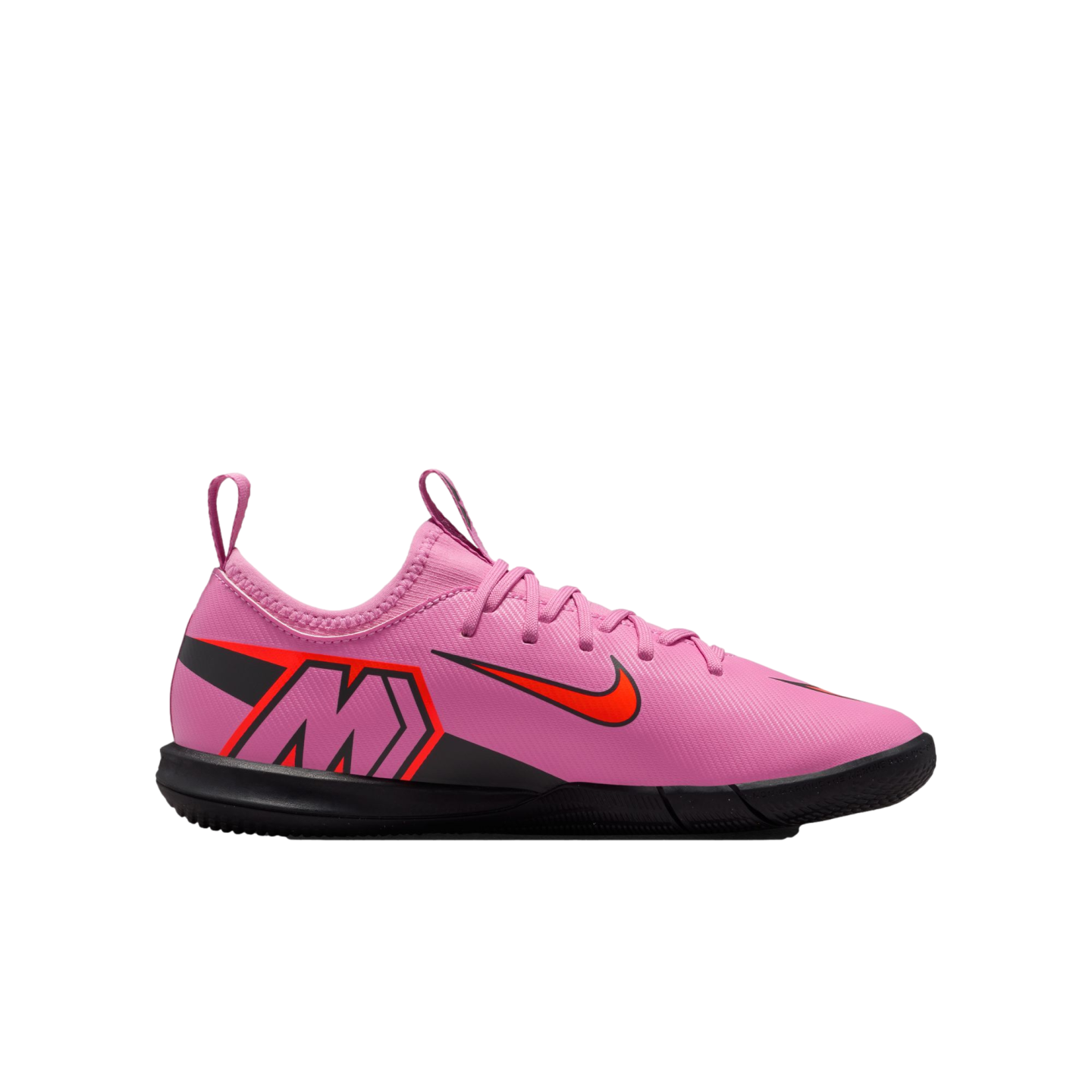 A pink Nike Mercurial indoor soccer shoe featuring a black sole, bright orange accents, a large "M" logo on the side, and a textured upper against a black background.