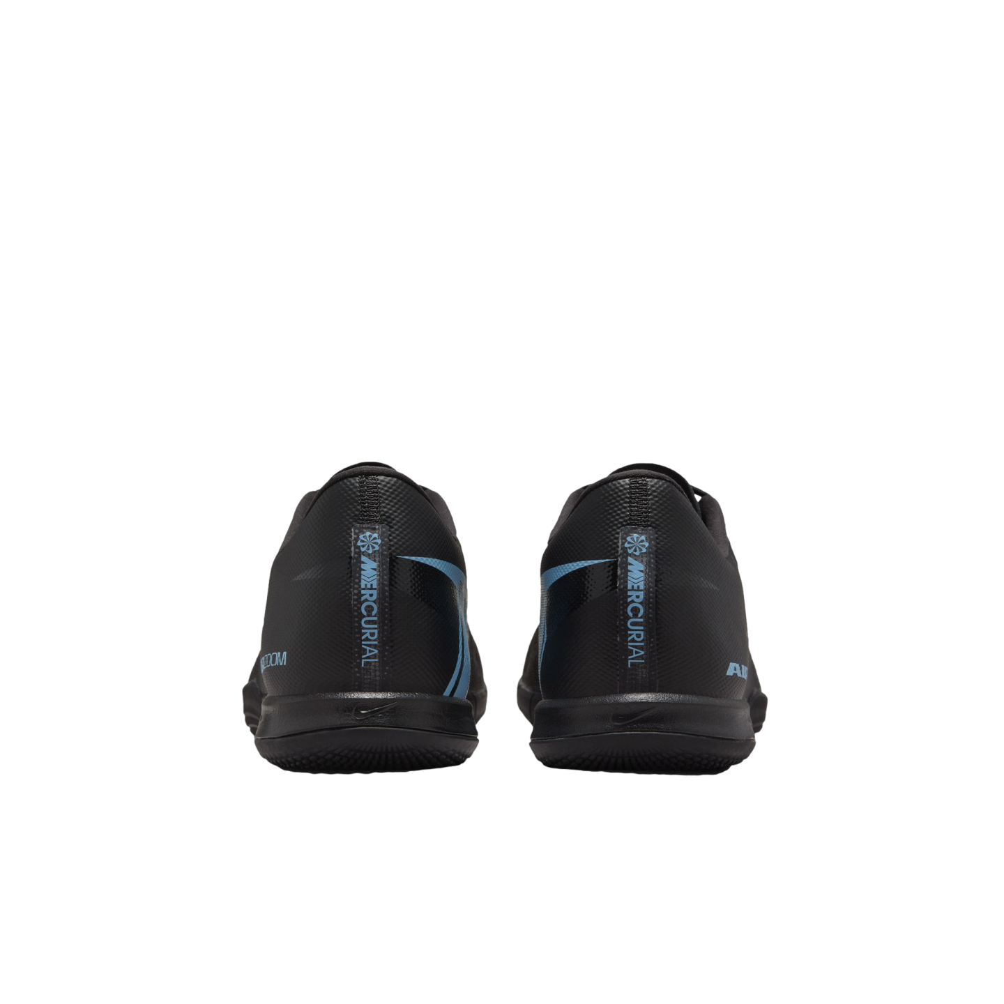 Rear view of black Nike Mercurial soccer shoes with light blue accents and "MERCURIAL" branding on the heels against a black background.