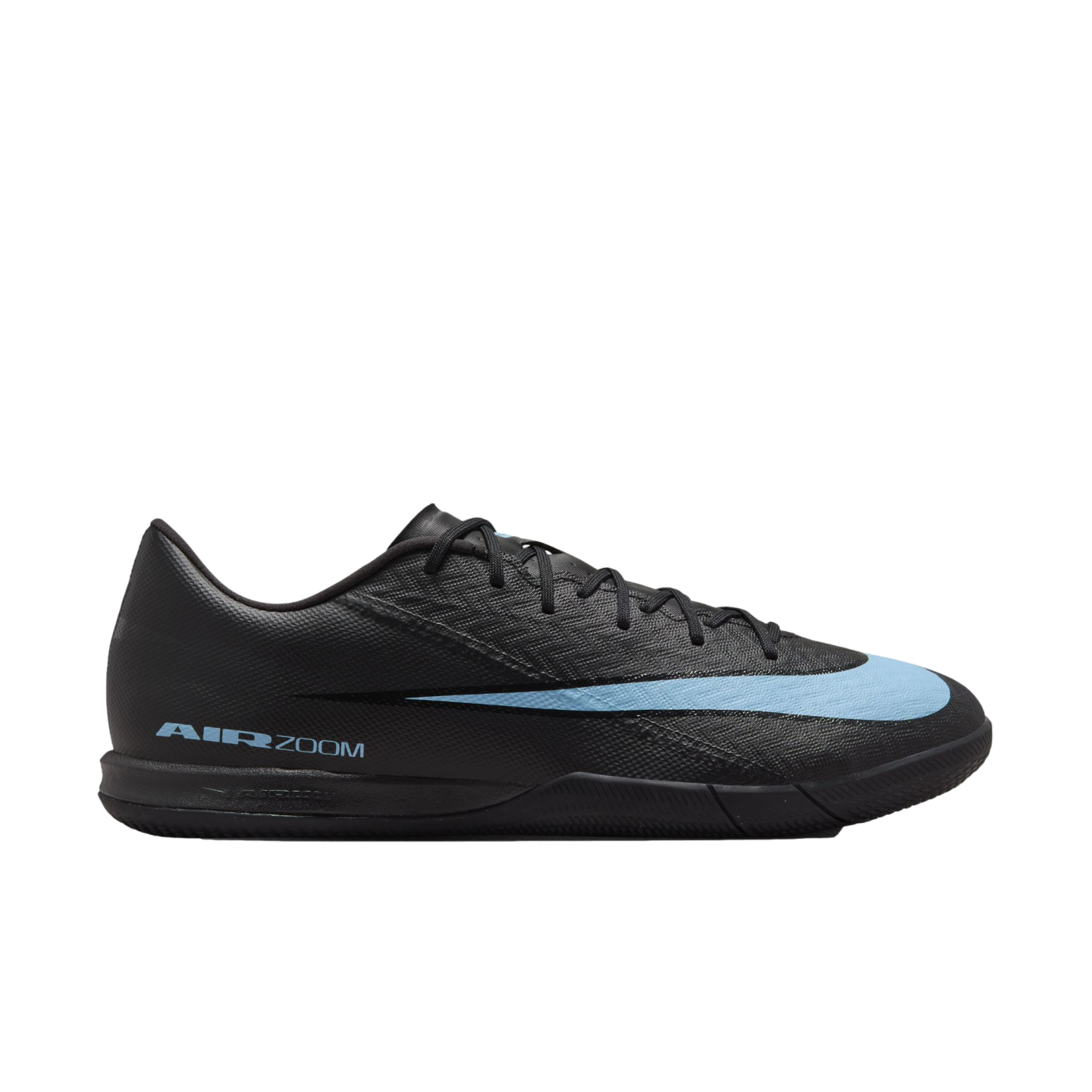 Profile view of a black Nike Air Zoom indoor soccer shoe with a light blue Nike swoosh and branding.