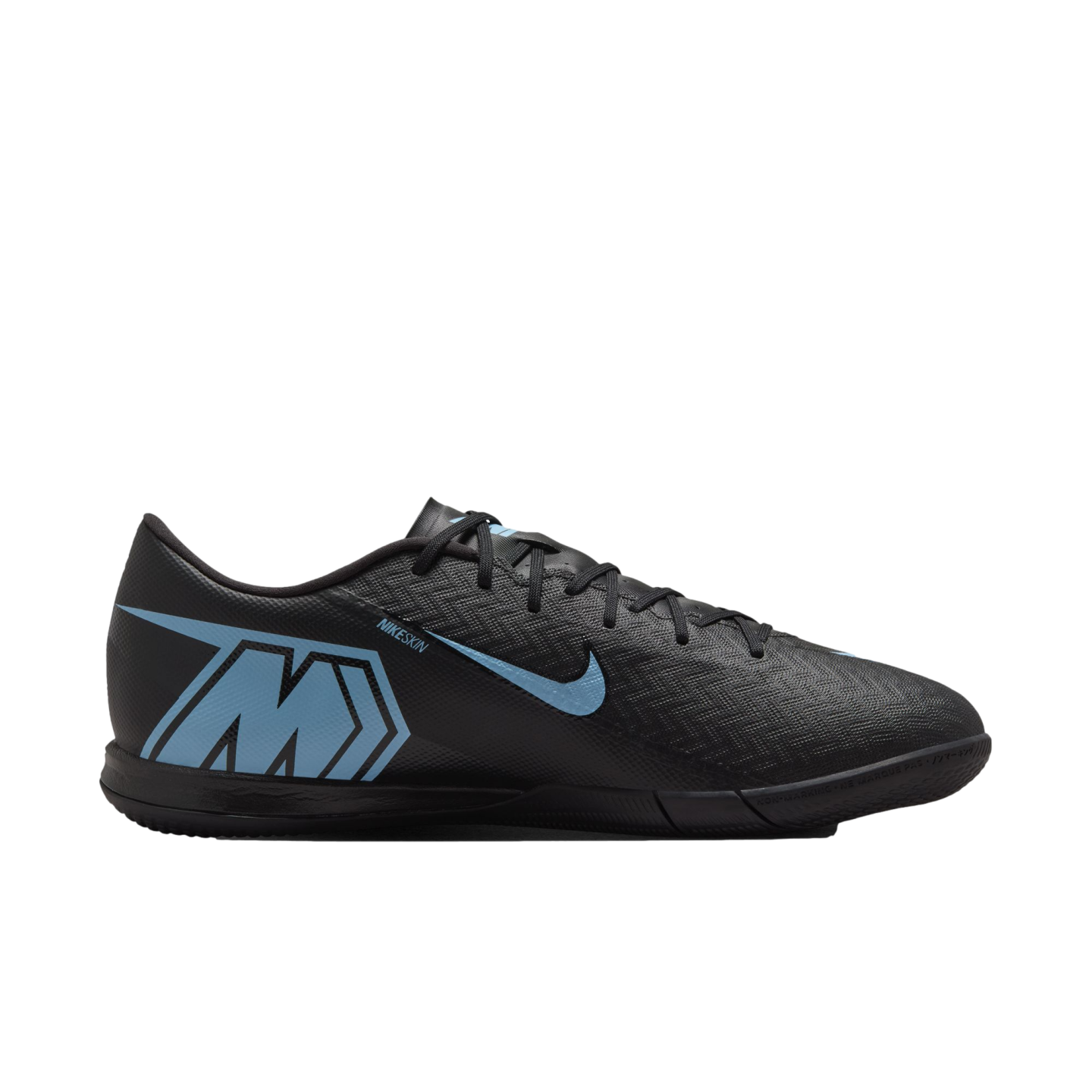 Side view of a black Nike Mercurial indoor soccer shoe with light blue accents, featuring a textured upper and a large "M" logo on the heel.