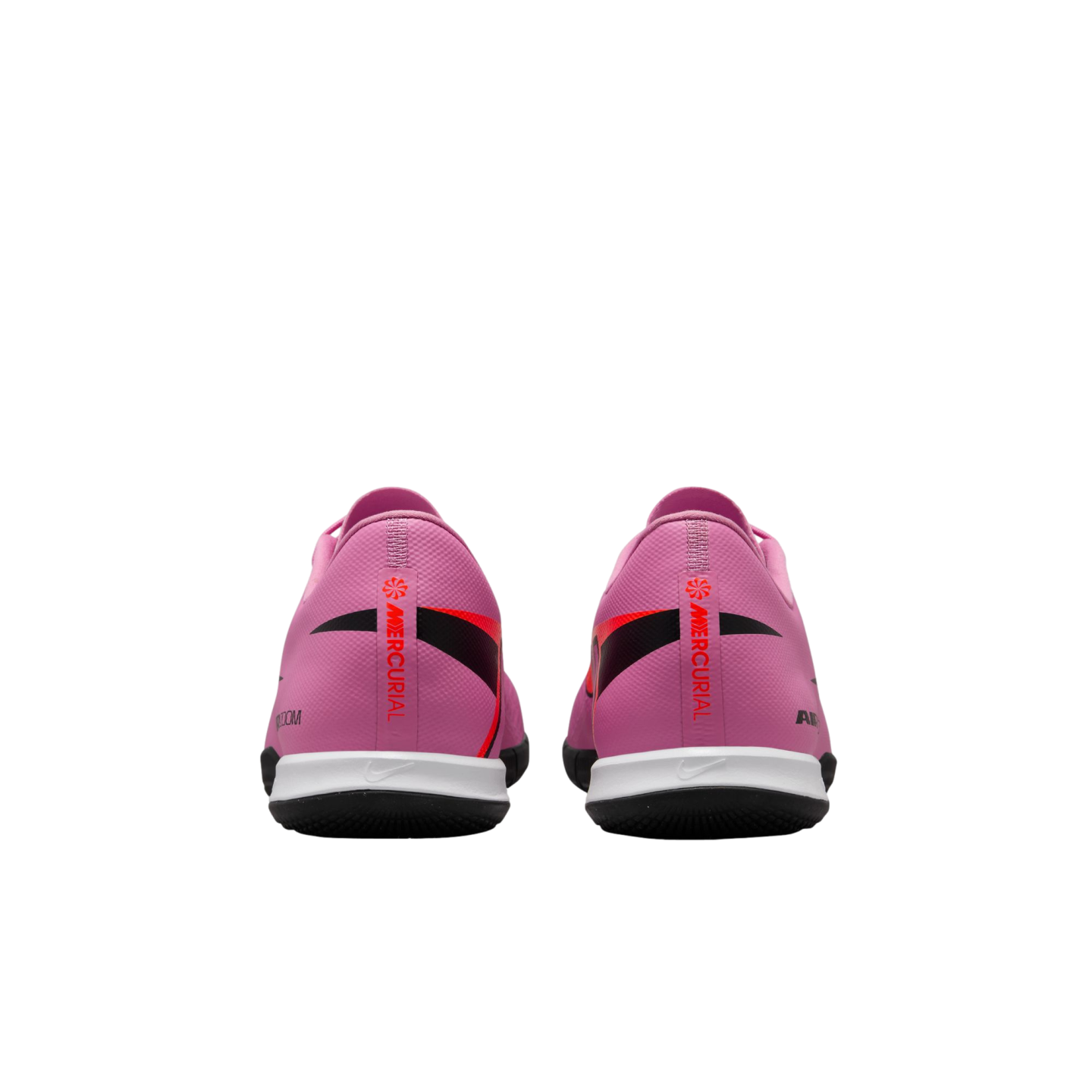 Rear view of two pink Nike Mercurial soccer shoes with red and black accents and white midsoles on a black background.