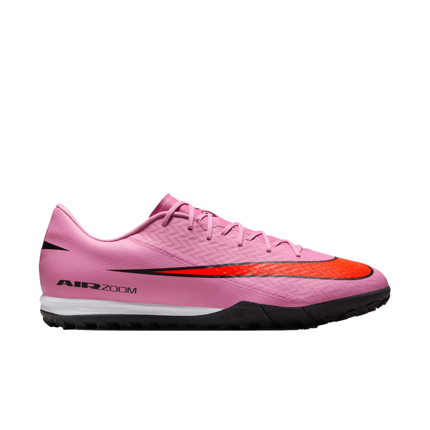 Profile view of a pink Nike Air Zoom turf soccer shoe with a large red swoosh, white midsole, and black outsole.