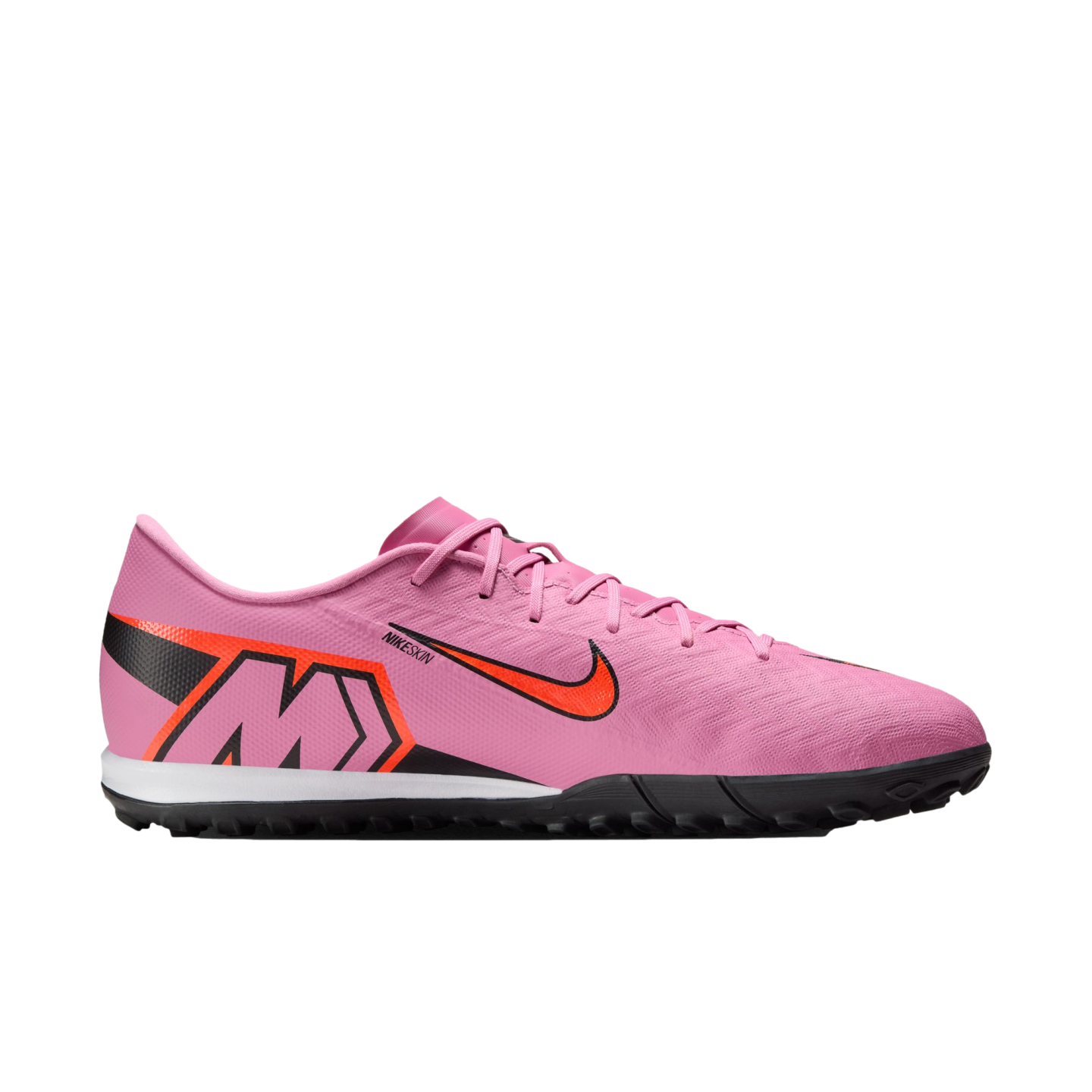 Side profile of a pink Nike Mercurial soccer shoe with orange accents and a black turf sole against a solid black background.