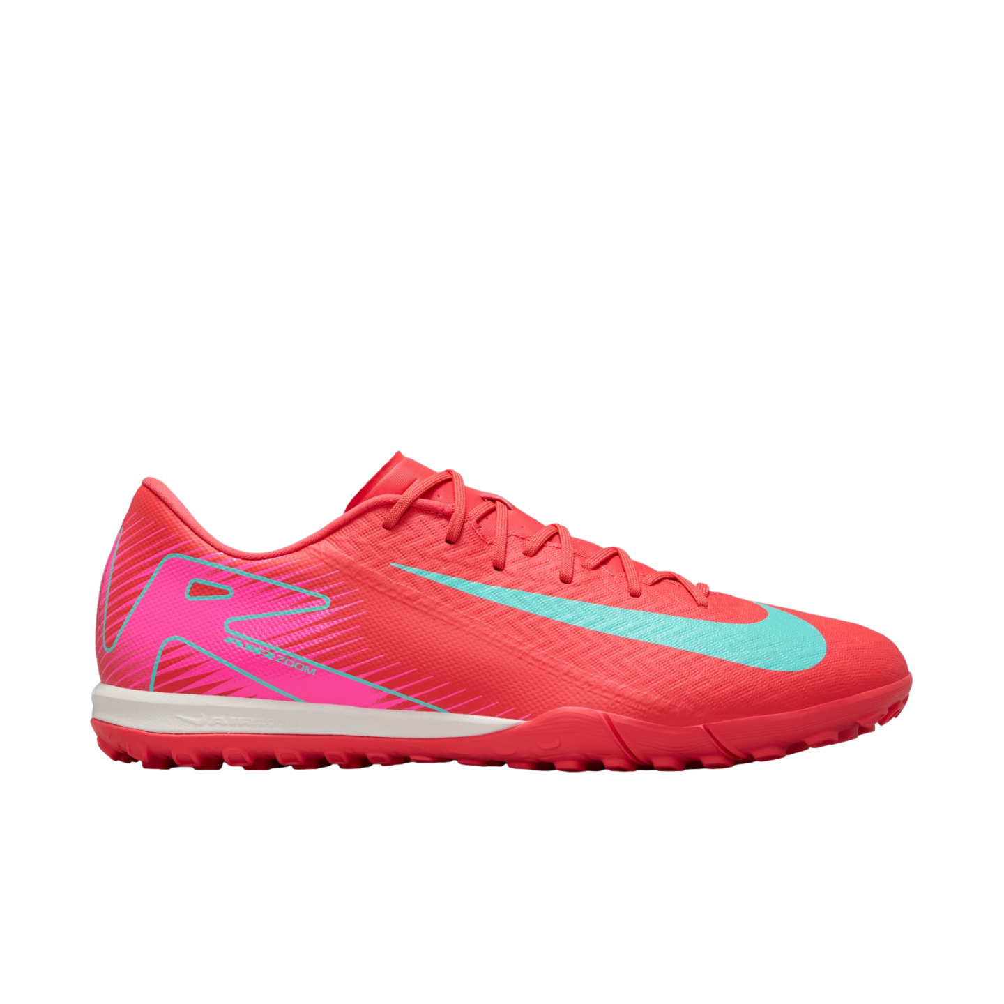 A profile view of a vibrant pink Nike turf soccer shoe featuring a light blue swoosh, white midsole, and pink studded outsole, set against a plain white background.