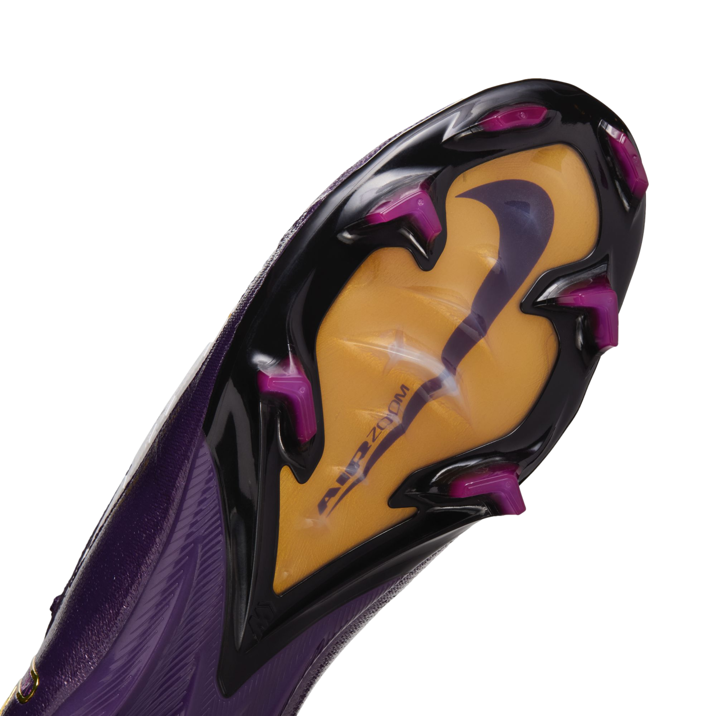 Underside of a purple Nike soccer cleat showing a gold "Air Zoom" sole plate, a purple swoosh, and magenta studs on a black outsole frame.