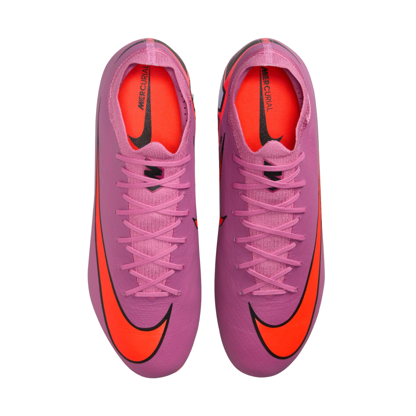 A top-down view of vibrant pink Nike Mercurial soccer cleats with large orange swoosh logos on the toes and bright orange interior lining, displayed against a black background.