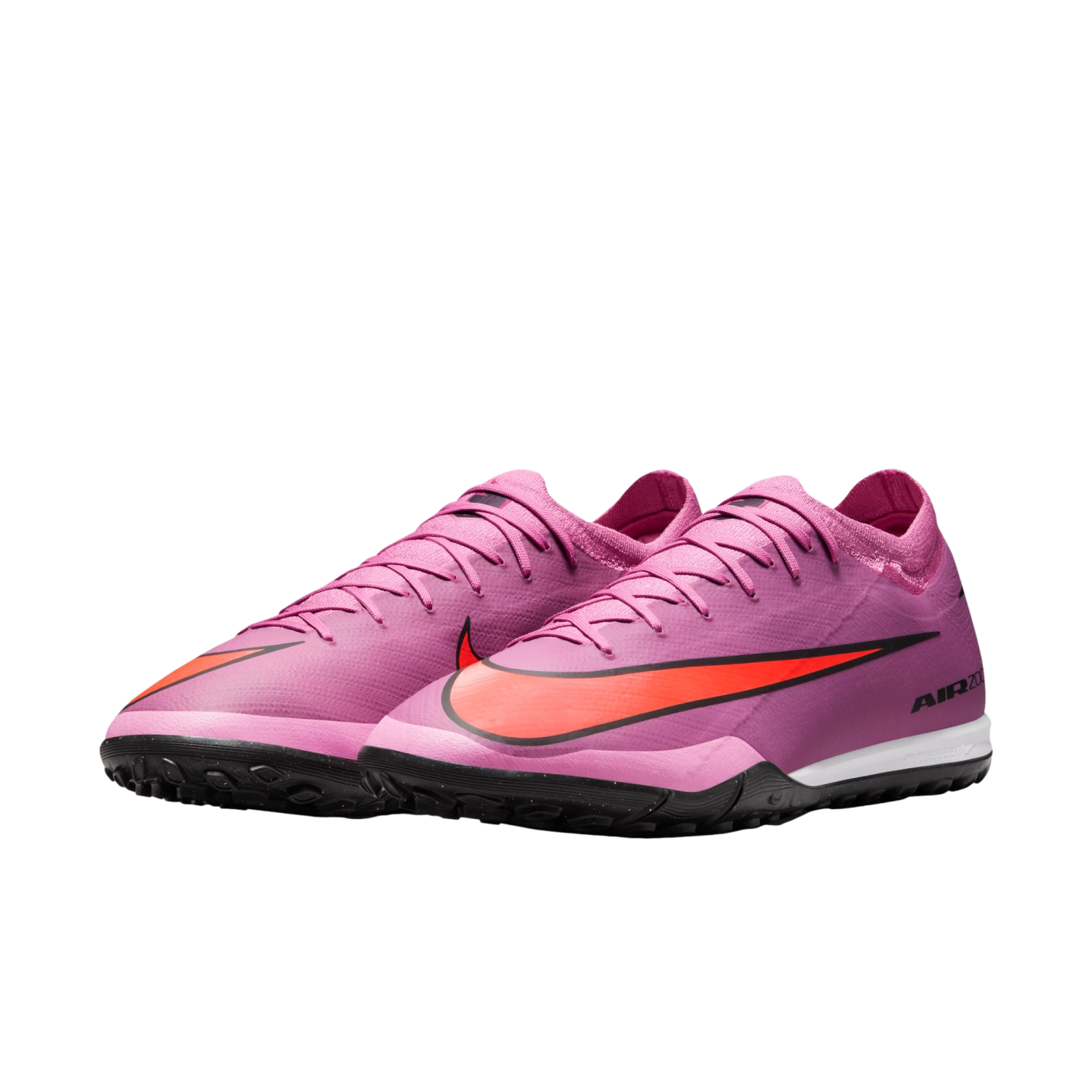A pair of magenta Nike Air Zoom turf soccer shoes with orange swooshes and black soles on a plain black background.