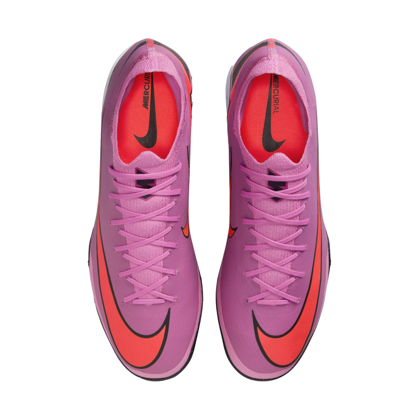Overhead view of two purple Nike Mercurial soccer cleats with vibrant orange Swooshes and interiors, displayed on a black background.
