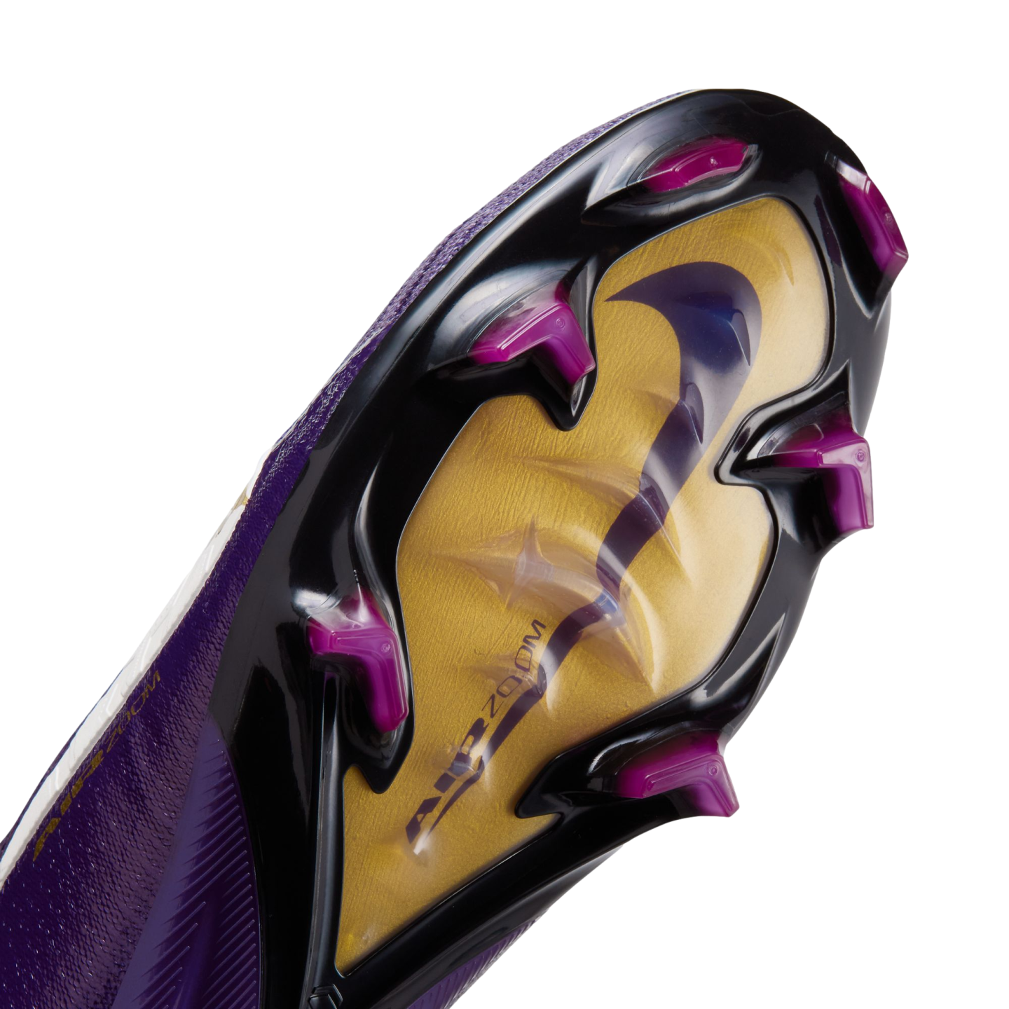 Close-up of a Nike soccer cleat's soleplate featuring a gold and black design, magenta studs, and a large iridescent swoosh over "AIR ZOOM" branding.
