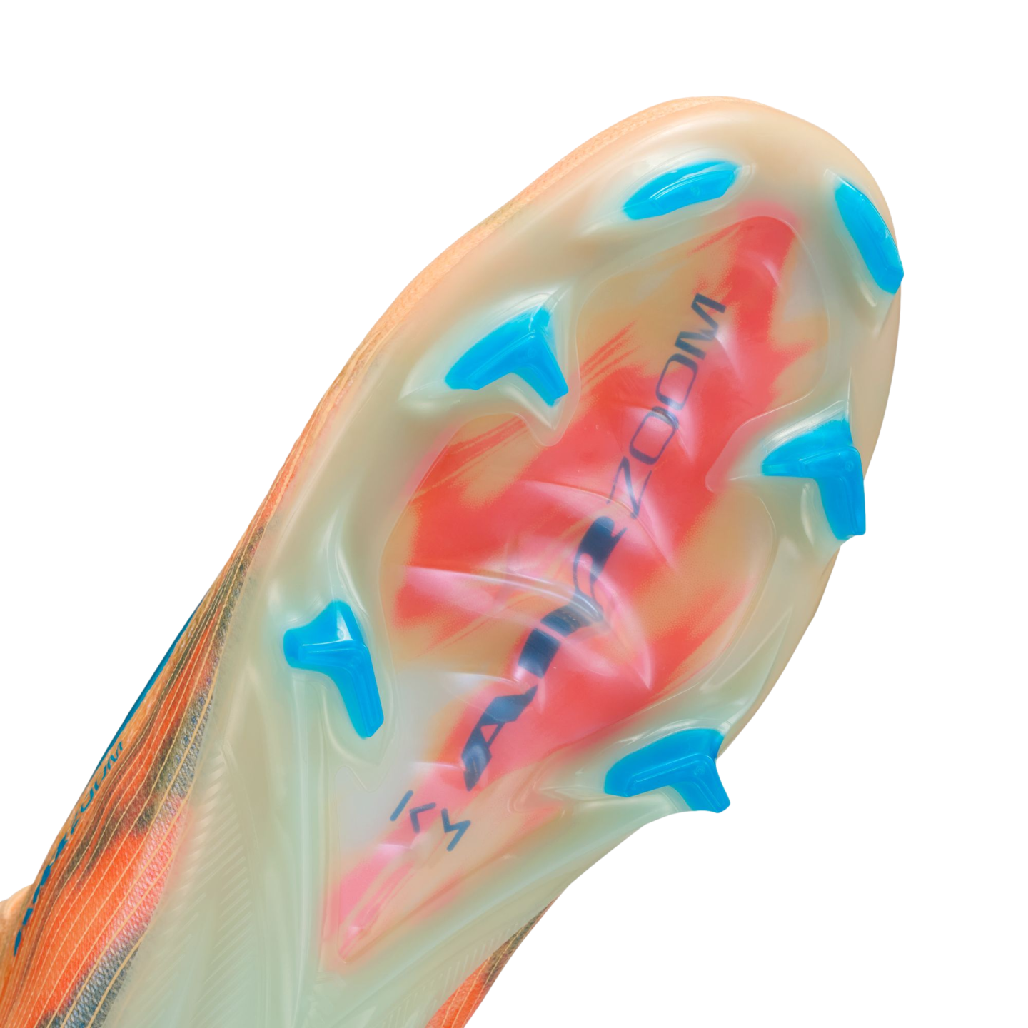 Close-up of a Nike soccer cleat's translucent sole plate with blue studs, featuring a red graphic and "AIR ZOOM" text visible underneath.