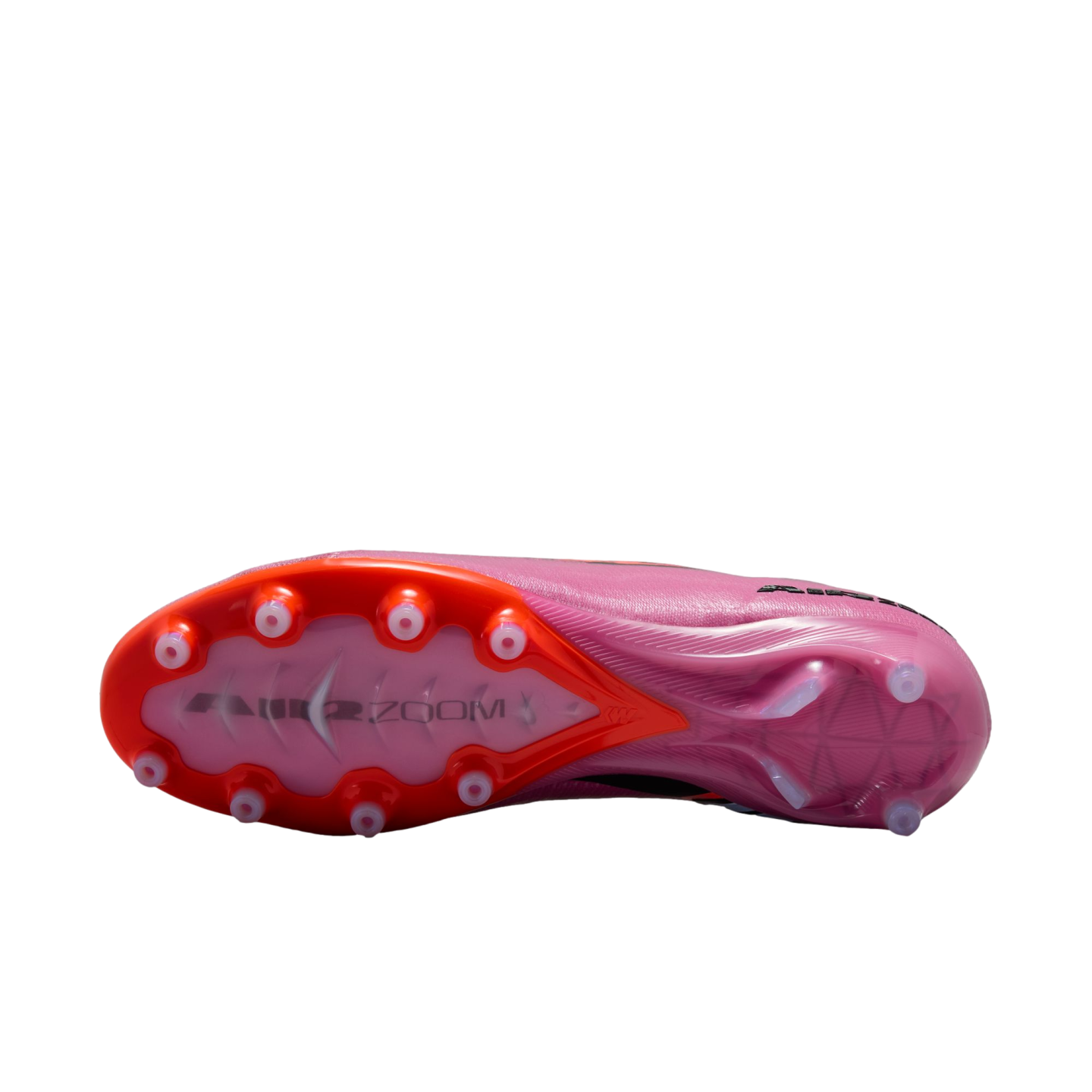 The bottom of a pink and orange soccer cleat against a black background, showing the stud pattern and "AIR ZOOM" branding on the soleplate.