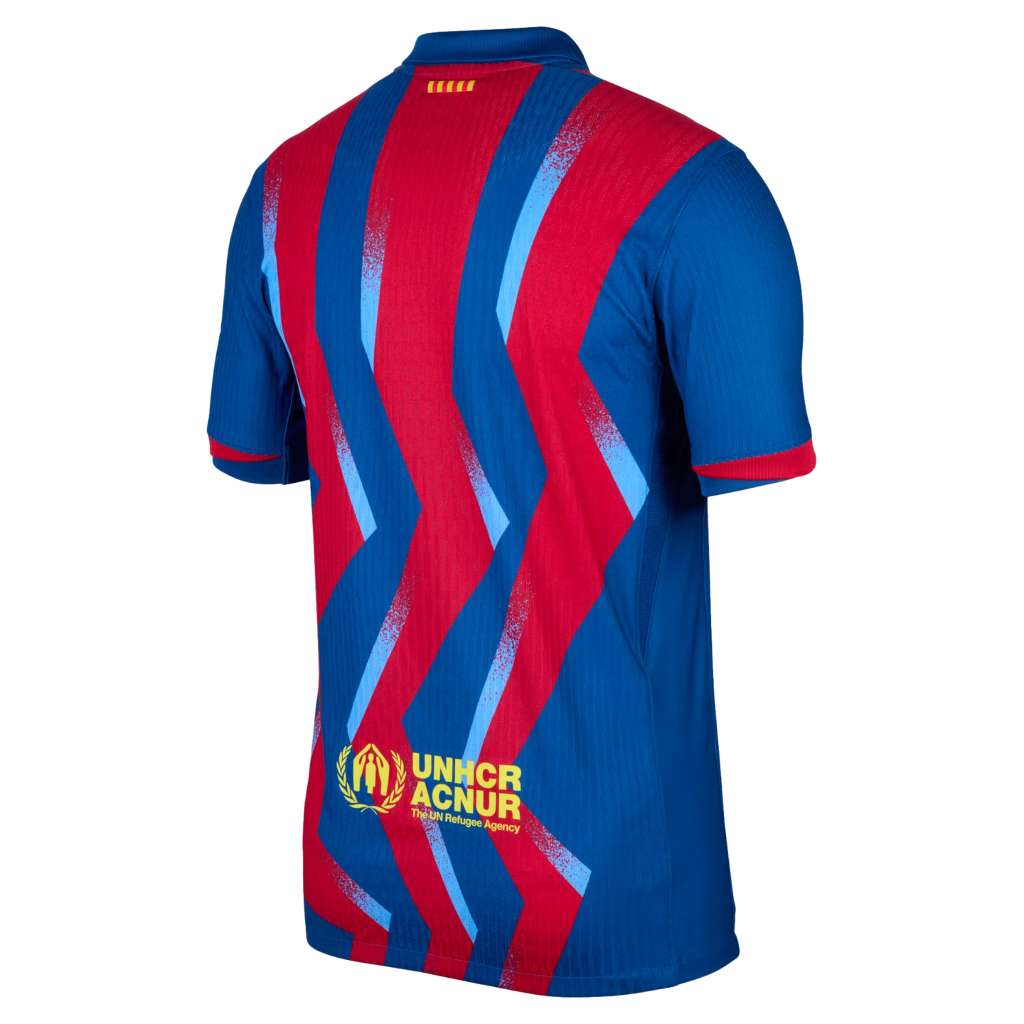 Back view of a blue and red soccer jersey with jagged zigzag stripes. Features a yellow UNHCR ACNUR logo on the lower back and a small Catalan flag near the collar.