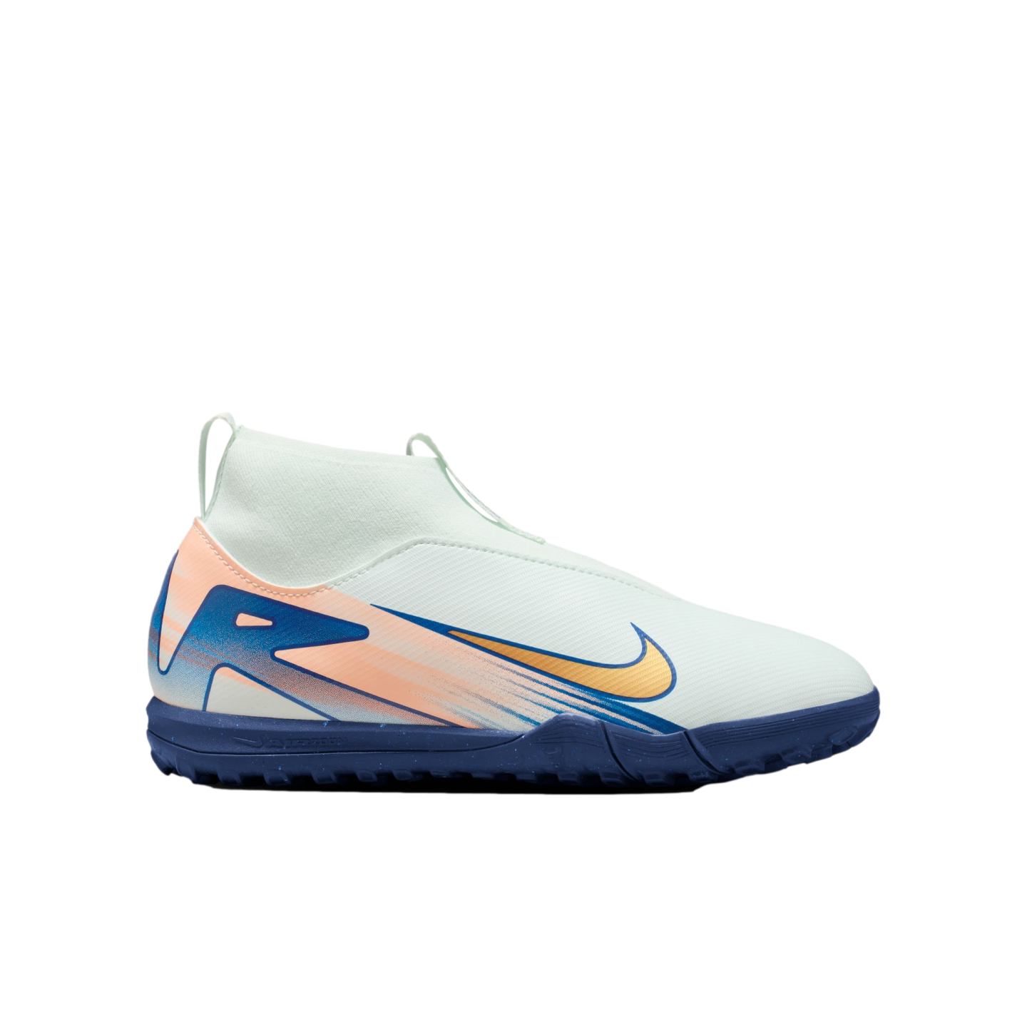 A pale green Nike turf soccer shoe featuring a gold swoosh, orange and blue graphics, a high-top sock-like collar, and a dark blue textured sole.