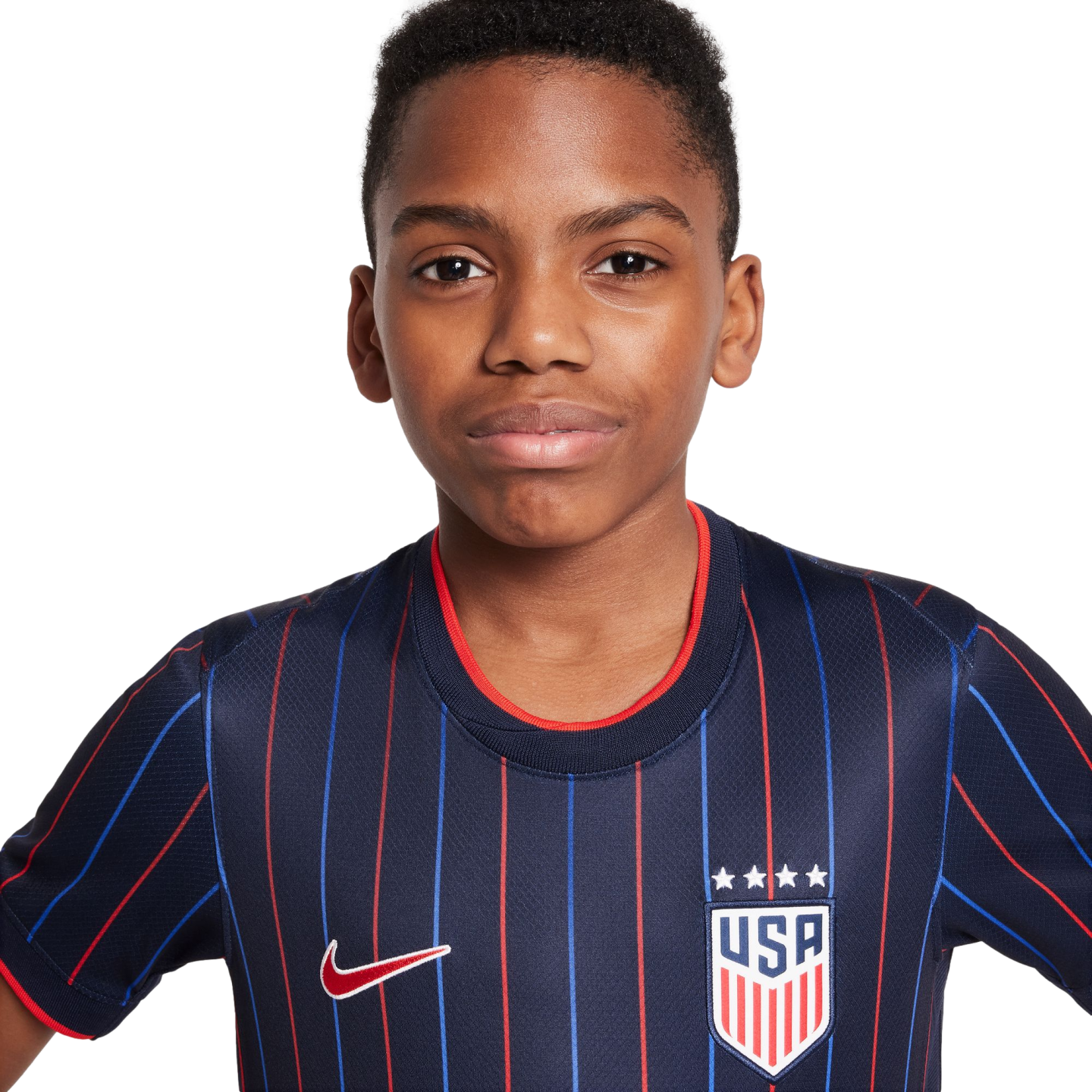 A young Black boy wearing a navy blue USA soccer jersey with red and blue stripes, a Nike swoosh, and the USA crest, posed against a white background.
