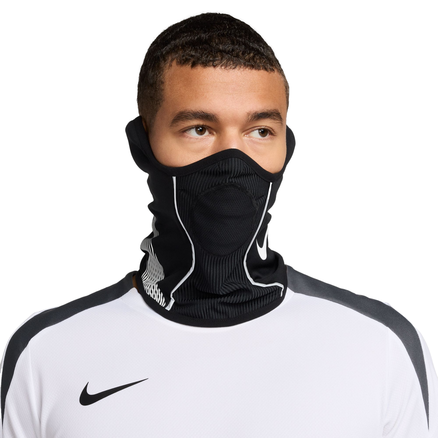 A man wearing a black Nike neck warmer with white accents over his face and a white Nike athletic shirt, set against a solid black background.