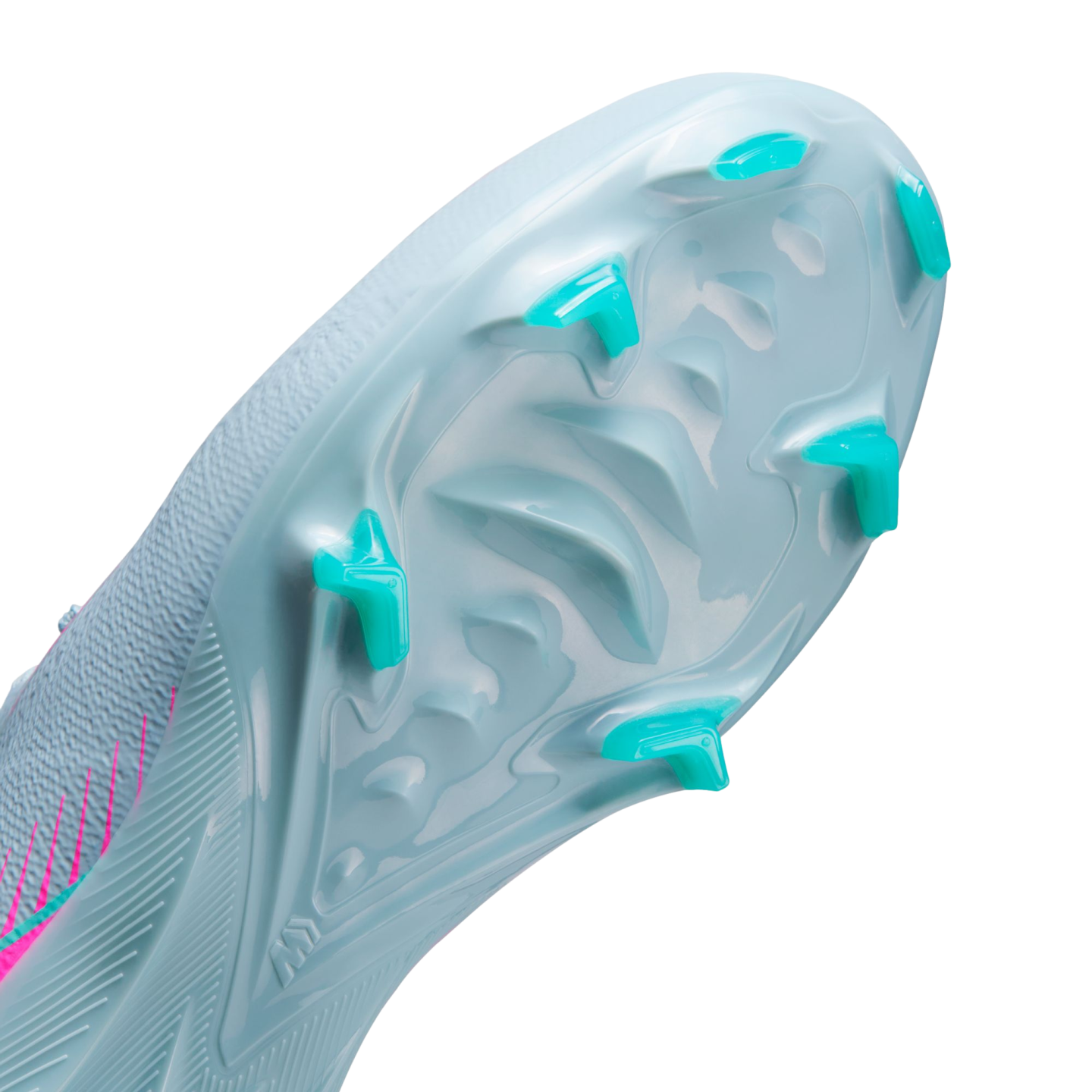 Close-up of the light blue soleplate of a soccer cleat, featuring bright teal traction studs and vibrant pink accents on its textured upper.