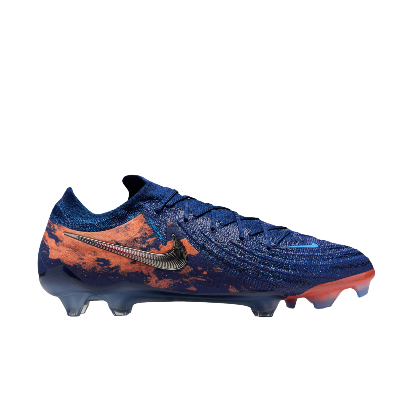Side view of a blue Nike soccer cleat featuring a marbled orange graphic, metallic silver swoosh, and a translucent studded sole on a white background.